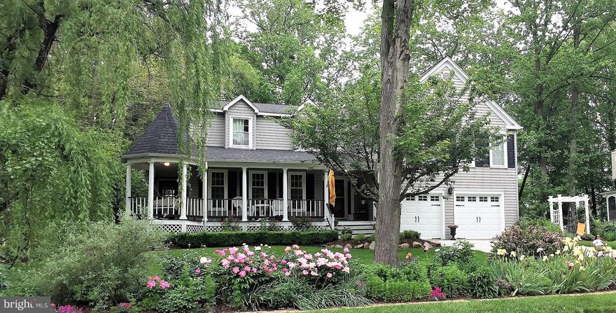 ****Update***  Contract deadline is Sunday at 5:00 PM*****Welcome Home!!!  You will absolutely LOVE this wonderful home with almost 3900 Square feet of finished space and another almost 700 unfinished.  Check the Floor plans in docs!  OAKTON School Tier!!! Features include....a huge farmers porch which wraps around the side.   Plenty of seating/entertaining out front.  The front door with sidelights welcomes you into a foyer with hardwood floors, 5" Baseboard and crown molding.   To the left you will find a huge living area with a step up to the massive dining room.   A barn door hides the laundry, utility sink and pantry area.   NOW...welcome to the gourmet kitchen with an 80k remodel.  Huge island for entertaining and an eat in area!  Gas cooking with a 5 burner range!!  The kitchen overlooks a fabulous family room with LVP and a welcoming wood burning fireplace.  Exit out from this level to an expansive 2 level deck overlooking a flat useable backyard!   Lower level features LVP a rec room, reading nook and potential 5th br/office.   UPSTAIRS features a HUGE 2 level primary suite with sitting area, a room that could be used as an office, a cedar closet, massive walk-in closet, separate WC, large jetted tub and separate shower.   3 other bedrooms up as well with a dual vanity remodeled bathroom.  
This property will literally wow you as you take in the spaciousness and the brightness!   More Info. in Docs!!   Interactive floor plan available.    *** 3 Links in Virtual Tours***