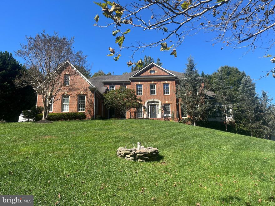 Experience timeless elegance and modern sophistication in this exquisite estate home located in the sought-after Wynnewood community of Davidsonville. Boasting over 7,200 square feet of meticulously designed living space, this residence was fully renovated in 2015 with no detail overlooked. From the moment you enter, you’re greeted by a grand double staircase and Brazilian hardwood floors that flow throughout the home, setting the tone for the craftsmanship and luxury within. The gourmet kitchen is a chef’s dream—complete with an oversized island, custom cabinetry, designer backsplash, sleek new countertops, and Sub-Zero and Wolf appliances. The two-story family room impresses with soaring ceilings and a striking natural stone wood-burning fireplace—one of two fireplaces in the home. Just off the kitchen, the sunroom offers a seamless connection to the backyard oasis, perfect for effortless entertaining. Formal living and dining rooms provide elegant spaces for gatherings, while a private office, mudroom, laundry room, and half bath complete the main level. Upstairs, the open loft area overlooks the family room below. The luxurious primary suite features a tray ceiling, spa-inspired bath with soaking tub and separate shower, and a spacious walk-in closet. Each of the three additional bedrooms includes its own en suite bath, offering comfort and privacy for family and guests alike. The fully finished lower level is an entertainer’s dream, featuring a custom live-edge wood bar, wine cellar, fitness room, game area, Norwegian sauna, and expansive recreation room. A guest bedroom with a full bath provides the perfect retreat for visitors. Step outside to your private resort-style paradise — a travertine patio, heated pool, and hot tub surrounded by natural stone retaining walls and lush professional landscaping. The screened gazebo, irrigation system, and outdoor lighting complete this spectacular setting. Additional recent upgrades include new HVAC systems, a whole-house generator, water purification system, new roof and gutters, and more—ensuring peace of mind and comfort for years to come.
This is more than a home—it’s a lifestyle. Don’t miss the opportunity to own this extraordinary Davidsonville estate where luxury, comfort, and craftsmanship meet.