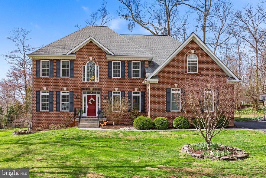 Welcome to a truly refined offering in the heart of Fort Hunt where timeless design, thoughtful upgrades, and a warm, family-friendly lifestyle come together effortlessly.

Built in 2015 by NDI as part of their coveted Estate Series, this exceptional residence has been beautifully enhanced over time, blending quality craftsmanship with modern livability. Sited on a picturesque half-acre along a quiet, tree-lined street, the setting is as inviting as the home itself, just minutes to Hollin Hall Shopping Center and within the beloved Waynewood Elementary district.

Inside, nearly 5,600 finished square feet unfold across three thoughtfully designed levels. The main level balances elegance and ease, featuring formal living and dining rooms for special gatherings, while the heart of the home is the open-concept kitchen and dramatic two-story family room—anchored by a striking stacked stone Astria gas fireplace. Whether hosting holidays or enjoying a cozy evening in, this space was designed to bring people together. A rare main-level bedroom offers flexibility for guests, multigenerational living, or a private office, while both a front and rear staircase add everyday convenience and charm.

Upstairs, the primary suite is a true retreat, complete with a sitting room and a custom-designed walk-in closet that feels as elevated as it is functional. Three additional bedrooms include a well-appointed shared bath and a private ensuite, offering comfort and space for everyone.

The recently finished lower level expands the home’s versatility with a recreation room, media space, gym, game area, full bath, and an additional legal bedroom, perfect for guests or extended stays.
Outdoor living is just as inviting, with a Trex deck overlooking mature landscaping and a spacious backyard ready for play, entertaining, or quiet evenings under the trees.

Additional highlights include a three-car garage with EV-ready capability and a functional mudroom/laundry area just off the garage, designed for the rhythm of daily life.

Located steps to the GW Parkway, bike paths, walking trails, parks, and the Potomac River.  Minutes from Old Town Alexandria and Mount Vernon, Fort Belvoir, The Pentagon, Huntington Metro, National Airport, and DC. 

This is more than a home, it’s a place to grow, gather, and create lasting memories in one of Alexandria’s most cherished communities.