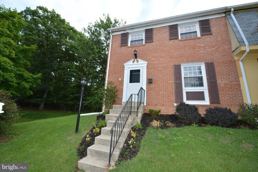 Complete remodeled end unit featuring ; Beautiful White/ Black cabinets, Granite counter tops, new appliances, mosaic back splash & ceramic tile floors. Family & Dinning room include bamboo flooring & access to back deck for easy entertaining. Master w/2 closets, new carpeting, attached bath w/walk in marble & glass shower. Basement  w/ bar, new fireplace, ceramic  flooring and full laundry room.