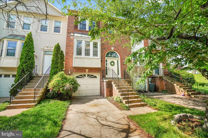 BRAND NEW ROOF 2024! FRESH PAINT! Smart light switches throughout! Beautiful brick townhome overlooking Ballenger Creek Park with 1-car garage. Deck & Backyard that backs to trees/open space. Open floorplan with hardwood floors throughout. Spacious kitchen with convenient pantry. Additional pantry/storage space near open dining room/living room. From the living room with wood-burning fireplace, access the deck with stairs to the backyard.  Primary bedroom suite with vaulted ceiling, en suite bathroom and walk-in closet. 2 additional bedrooms and hallway bathroom. The fully-finished lower level provides additional living space, a full bathroom, and plenty of storage, offering flexibility for entertainment or a home office. Privacy doors added to lower level to make a "suite" if you wanted to make this into an additional bedroom. There's also a separate laundry room for added practicality. With its excellent location and thoughtful design, this townhome is ready to become your ideal home! Additional Upgrades: new roof 2024, new insulation 2023, windows less than 10 years old, HVAC and Water Heater 2015,