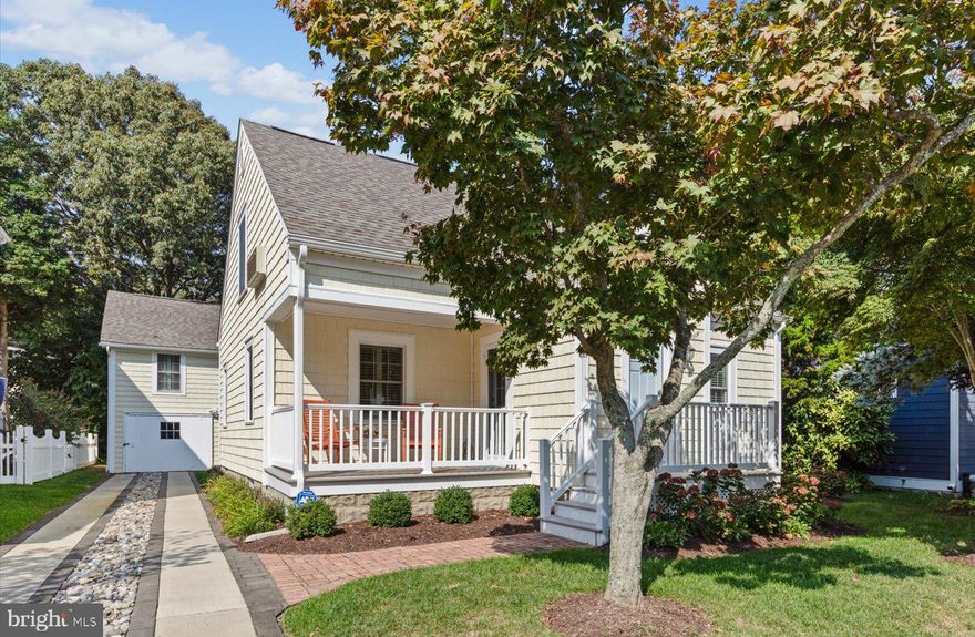 Nestled just 1.5 blocks from the iconic Rehoboth Beach boardwalk and the beautiful sandy beaches, this lovingly maintained and updated cottage offers the perfect blend of classic coastal charm and modern conveniences. The main house features 4 spacious bedrooms and 2 beautifully updated bathrooms. The detached garage apartment adds extra versatility with an additional 2 bedrooms and 1 full bath. Step inside the main house to find an updated kitchen featuring stainless steel appliances, sleek granite countertops, and new cabinetry. The bathrooms are elegantly renovated with modern fixtures, tiled floors and updated vanities.  Being sold tastefully furnished and featuring fresh paint inside and out, this home is truly move-in ready. Outdoor living is equally impressive, with a welcoming front porch ideal for enjoying the neighborhood, a spacious and private backyard with patio space, outdoor showers for rinsing off after beach days, and lush green areas for relaxation or play. The 2-car garage includes a delightful garage apartment, complete with hardwood floors, a modern galley kitchen, a cozy living area, and its own private porch – perfect for guests or rental income. This beachside gem is a must-see for those looking to experience the best of South Rehoboth Beach living.