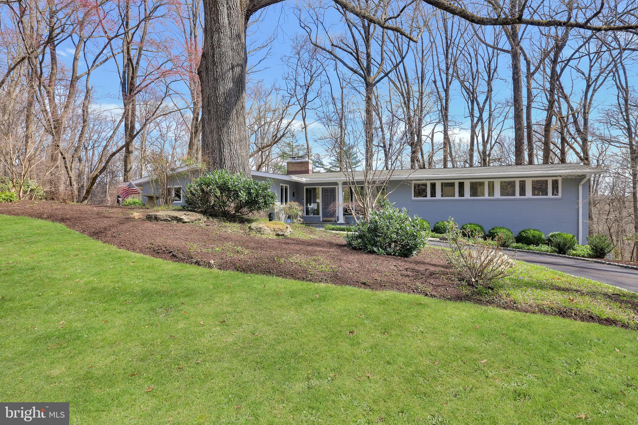 Exceptional Properties. Exceptional Clients. Welcome to 1902 Indian Head Road—a spacious mid-century modern 5-bedroom, plus 2 bonus rooms, 3.5-bath home that perfectly balances comfort, style, and convenience in the heart of Ruxton. Nestled in a tranquil, wooded setting, this meticulously maintained property in Ruxton Hills backs up to Lake Roland Park and is just minutes from essential amenities and quick access to downtown.
Boasting over 5,500 sq. ft., this thoughtfully designed home features a spacious and inviting floor plan, perfect for both everyday living and entertaining. Sunlight floods the interior through large south facing windows, highlighting the gleaming hardwood floors throughout. The gourmet kitchen features stainless steel appliances, a double oven, and a 12-ft. island with floor to ceiling cabinetry offering plenty of storage. A generous breakfast nook off the kitchen overlooks a large bluestone covered patio, perfect for morning coffee or evening relaxation. Come unwind in the family room right off the kitchen, with a wood burning fireplace and elegant built-ins. For more formal entertaining, a seperate grand dining room features crown moulding and easy access to the kitchen perfect for holiday gatherings. Down the hall, enter into a desirable first-floor primary suite with spacious walk-in closets, a luxurious spa-like bathroom, sitting area, and an adjacent laundry room and personal office for a true retreat experience.
With multi-level living spaces, each adorned with a wood-burning fireplace, there is ample space for both relaxation and entertaining throughout the home. The lower level is a versatile space, designed for entertaining, complete with a wet bar featuring an ice maker, dishwasher, refrigerator, a multi-purpose room perfect for game nights and gatherings, and 3 additional bedrooms/bonus rooms and full bath. The attached two-car garage and mudroom provide ample storage and convenience, streamlining your daily routines. With these additional bonus rooms comes endless possibilities—think home office, au-pair suite, playroom, or personal gym.
Step outside the lower level to appreciate the peaceful ambiance of the private patio with a charming moss fountain and room for multiple seating areas. Mature landscaping throughout, enjoy watching the daffodils bloom in the spring, the Japanese maple peak in the fall or the 400 year old majestic oak tree uplit in the front circle. This well-maintained property is complete with an irrigation system, landscape lighting, and gutter guards.
With many recent upgrades, including a new heat pump installed in 2022, an AC unit added in 2024, a brand new roof in 2021, and a generator, this home offers modern comfort that checks all of the boxes. Schedule your private tour of 1902 Indian Head Road and make it your forever home.