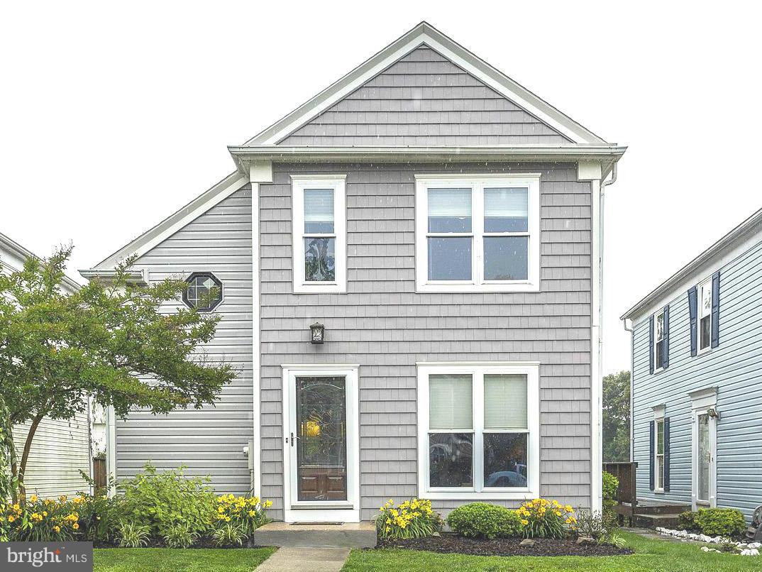 Beautifully renovated home w/fantastic spaces to live & entertain. Inviting great room has vaulted ceiling, gas fireplace & hardwood floors. Kitchen gleams w/cherry cabinets, stainless appliances & custom granite counters/bar seating. Grill out & relax on back deck! Basement family room w/stylish new floors is warmed by gas fireplace. Walk out to patio & landscaped yard. Great community amenities!