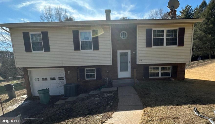 ALL OFFERS DUE 3/2 by 6pm.  Potential-filled split-level residence offering 1,028 square feet, 4 bedrooms, 2 full baths, and a 1-car garage in peaceful Westminster Election District. A work in progress, this home presents an excellent opportunity for an investor or a first-time homebuyer ready to take on a rewarding challenge.

Inside, the upper level hosts three bedrooms and one full bath, while the lower level offers additional living space, including a fourth bedroom and a second full bath. The kitchen, though outdated, remains functional, with a layout that can easily be refreshed to suit modern tastes. An enclosed sunroom addition provides extra space for relaxation or entertaining, while the wraparound deck, though in need of some TLC, offers great potential for outdoor enjoyment.

Currently, the home has no flooring, stripped to plywood throughout, allowing for a fresh start with new materials of your choice. However, major systems have seen recent updates, including an oil tank replaced 2 years ago and an Water Heater is 2 and a half years old, providing peace of mind for the next owner.

With some effort and creativity, this home can be transformed into a charming and comfortable space, making it a fantastic investment in a desirable location.

Use back deck at your own risk.