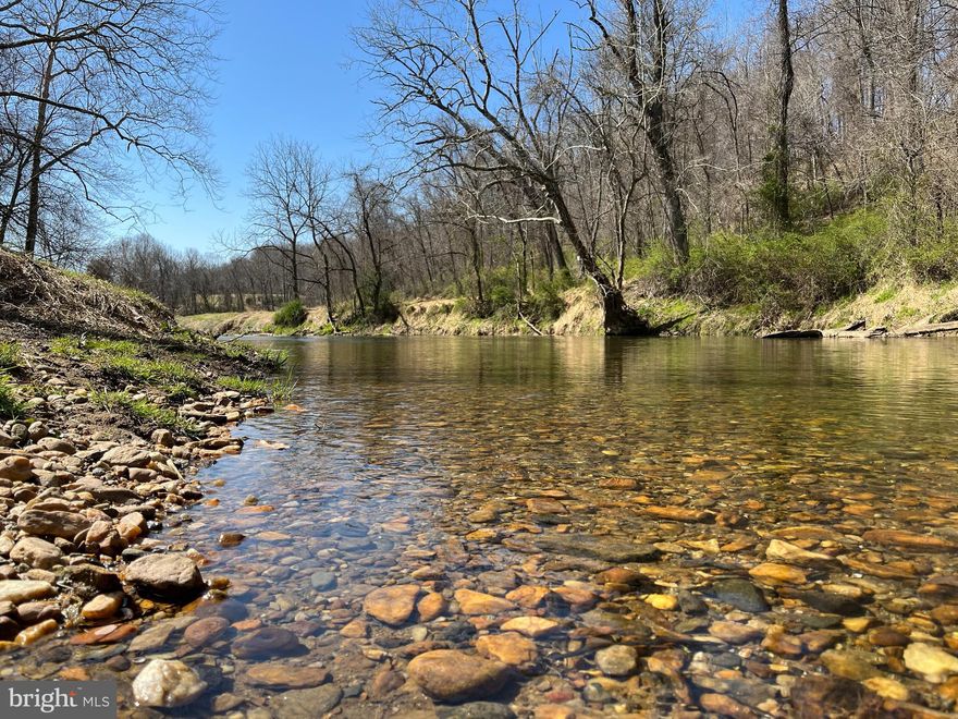 This newly renovated home feels like owning a state park!  It sits on 92 acres with approximately 7/10 of a mile on Deer Creek, miles of maintained trails for horses/ATVs, natural springs, lots of timber, and a small creek.   Wildlife abounds with fish, turkey, deer, foxes, coyotes, and more!  The creek has a private beach with deep water.    

The house sits on the crest of a hill with spectacular sunsets and picturesque pastoral views of the valley below and a dairy farm.   It was fully renovated in 2020 (interior) and 2022 (exterior) with premium materials (i.e., Marvin Windows, James Hardie Siding, marble countertops/shower, natural stone veneer, bluestone/wrought iron patio, and Trex lighted decking).   Mature privacy trees (i.e., Green Giant Arborvitae) planted last year along the roadside and adjacent field.  

There is a 30x60 garage with three bays, custom shelving, and a generator back feed to the house.  There is a 24x42 high-bay pole barn with epoxy shop floors, closed cell insulation in walls and ceiling, insulated shop door, mini-split HVAC units, home office, guest room, internet, and generator hookup.  There is also a gravel pad with a 50-amp RV hook up.  

Additional upgrades include a HVAC unit and ductwork (2020), drain tile system in basement (2020), driveway (2021), hot water heater (2020), kitchen appliances (2020), and lots of landscaping.  

*This listing includes three separate parcels (Tax Account: 03-043622, 03-361829 & 03-036340).   The property is in agricultural preservation and woodland conservation.  All three parcels will be sold together.  Although no development rights exist, a tenant house may be built subject to county approval.