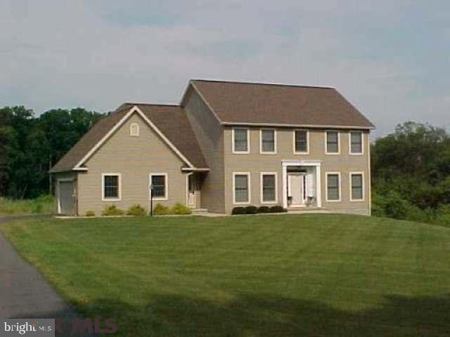 Pristine 2-story is perfectly positioned on 3.06 country acres yet only a quick 13 minute commute to Boalsburg. Even the most persnickety buyer will fall love this impeccably maintained home. Maxed out with upgrades through-out, featuring a free-flowing floor plan, oak hardwood floors, cozy fireplace in the family room, custom cabinets & island in the spacious eat-in kitchen. The formal dining room boasts a wet bar & trey ceiling. French pocket doors to the living room for privacy, perfect for a home office/den. Upstairs delivers a fabulous master suite with walk-in closet, private full bath with dual vanity, jetted tub & separate custom tile shower. The full unfinished walk-out lower level provides plenty of storage or future/additional living space. Additional highlights include 1st floor laundry room, oversized side-load 2 car garage & large deck over-looking the beautiful back yard, mountain ranges & farmland. Immaculate House + Country Setting = Commuters Dream!!