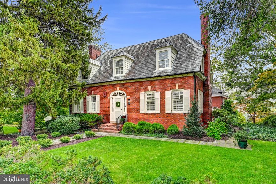 Exquisite and inviting, this charming residence awaits its next chapter.  The current owners are only the third caretakers of this property.  Step through the front door and you’ll immediately notice the meticulous attention to detail that shines throughout and makes this home truly stand out.  Architectural highlights include original 1930s arched doorways, elegant crown molding, and gleaming hardwood floors, all testaments to classic craftsmanship.  The gourmet kitchen is a recent renovation featuring soft-close cabinetry, gleaming Quartzite countertops, high-end stainless steel appliances, and a butler’s pantry complete with a wine refrigerator.  Enjoy breakfast in the inviting nook with built-in seating, or savor your morning beverage on the sunlit morning room just off the kitchen.  The formal Dining Room and Living Room each open onto the covered porch, making entertaining effortless.  A dedicated first-floor office provides an ideal space for remote work or study.  Upstairs, the Owner's Suite offers two walk-in closets with automatic lighting and a luxury bathroom featuring a beautifully tiled shower and elegant tile flooring.  The second floor also includes two additional bedrooms, another full bath, a cozy sitting area with closet space, and a spacious laundry room for added convenience.  Descend to the finished lower level to find a well-sized family room, fourth bedroom, and a powder room.  Ample natural light fills every space, creating a warm and welcoming atmosphere.  Recent updates since 2022 add to the appeal, including all-new wiring and plumbing, new kitchen, updates to all 4 bathrooms, freshly paved & expanded blacktop driveway, and a refurbished fish pond with added waterfall—complete with custom landscaping for a tranquil outdoor retreat.  This admired home is a true gem; visit and imagine your life here.