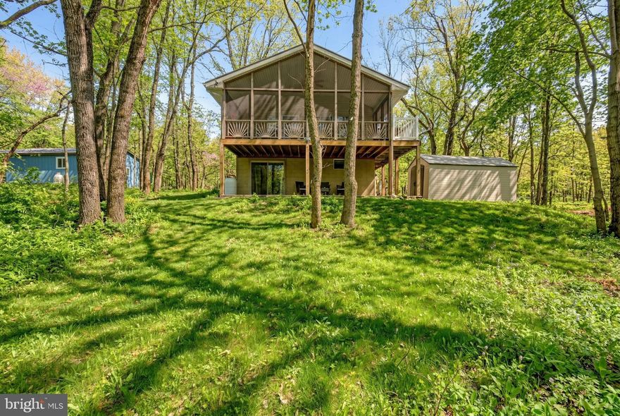 Plenty of fun here! Lovely home in Brier Crest Woods. Minutes from JFBB ski area, Hickory Run State Park, Jim Thorpe. Three Bedrooms on Main level, Cathedral Living Room/Kitchen with adjoining Screened in Deck. Enjoy the Natural Pocono terrain from your home with surrounding woods and serene setting. Lower level bar with kitchen, Family room Full bathroom and den with walk out slider to concrete patio. Circle Driveway with plenty of parking, firepit, storage shed. Walk, bike or golf cart to the private sandy beach and lake with swimming, boating and fishing. Furnished, Active Short Term Rental. Spring, Summer, Winter & Fall ''The Pocono Mountains 4 All Seasons''