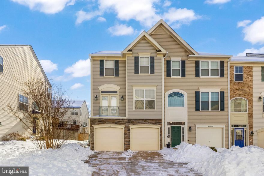 End unit rarely available in beautiful South Riding with world-class amenities.  2 CAR GARAGE 3 levels filled with natural light. Loads of usable outdoor space with a deck accessible from the kitchen and a brick patio in a fenced in back yard accessible from the cozy rec room. Gas fireplace. Great storage and a rough in for a 3rd full bath. Don't wait - this is the one. Make it your own. OPEN 1/31 and 2/1 2-4pm