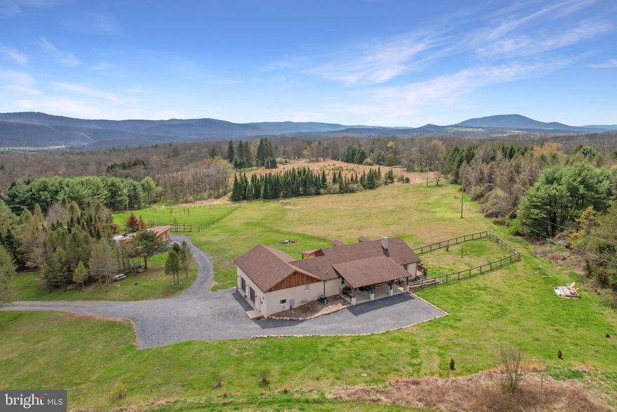 The Connectivity of Tomorrow, the Peace of Yesterday Ditch the commute, not the career. This meticulously curated sanctuary features dedicated underground fiber optic internet, providing symmetrical gigabit speeds that are a rare find in the Highlands. Whether you’re leading a global Zoom summit from your executive suite or streaming 8K video by the fireplace, your connection is as rock-solid as the mountains surrounding you.

🏠 Interior Excellence

• Designer Sophistication: Every inch of this home has been finished with high-end materials, from the brand-new spa-grade bathrooms to the country sink, granite counter tops, solid wood soft-close cabinets, walk-in pantry, and all new stainless steel appliances.

• The Guest Suite: A massive secondary living space with a brand new spa bathroom serves as the ultimate multi-generational solution or guest space.  It’s spacious, private, and designed for high-performance living.

🌲 A Park-Like Legacy

• The Christmas Tree Forest: Walk through your own piece of history. The property features a unique patch of woods from a former Christmas tree farm, offering a symmetrical, manicured aesthetic you won't find anywhere else.

• Turnkey Homesteading: Ready-to-go raised garden beds and a fully fenced yard mean you can start your hobby farm on day one.

🛠️ The Outbuilding and Garage: More Than Just Storage

While the house is the heart, the outbuildings are the soul of this property.

The "Man Cave"

Fully finished garage with heating/cooling: Home Gym, Studio, or Workshop

The Storage Loft

16’ x 20’ space above the garage: Climate-controlled storage or "Hideaway"

The Heavy Barn

Large structure with dedicated gravel access: store ATV or SxS to drive this ATV friendly area to any one of three river crossings

🥂 The "Three-Porch" Lifestyle

Outdoor living isn't an afterthought here; it's the main event.

1. The Social Porch: Full-length, covered, and equipped with custom lighting and fans. Designed for hosting summer galas or autumn wine tastings.

2. The Panoramic Gallery: A second full-length porch positioned specifically to capture unobstructed views of the Potomac Highlands.

3. The Pastoral Porch: A front-facing retreat overlooking peaceful fields—the perfect spot for your morning coffee and a book.