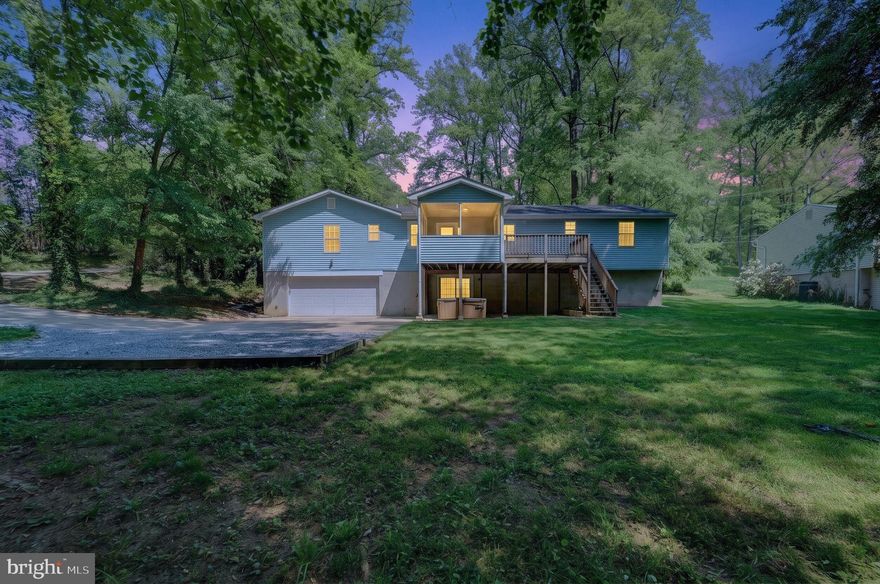 **OPEN HOUSE SATURDAY 5/2/2026 1-3pm** Stunning 5-Bedroom Home on a Private Double Lot in Arnold. Nestled on a rare double lot, this exceptional 5-bedroom, 4 full bathroom residence offers both privacy and versatility in a highly sought-after Arnold location, served by top-rated Blue Ribbon schools. Thoughtfully designed, the home provides an ideal layout for multi-generational living, including potential nanny or in-law accommodations. The main level features a spacious and functional floor plan with four bedrooms and three full bathrooms, complemented by gleaming hardwood flooring throughout. The beautifully updated gourmet kitchen is a chef’s dream, showcasing custom inset cherry cabinetry, high-end appliances, a large center island, and abundant counter space. Recessed lighting enhances the bright and inviting atmosphere, while the screened-in porch provides a perfect setting for relaxing or entertaining, with direct access to the adjoining deck. The fully finished lower level expands the home’s living space, offering a fifth bedroom, a full bathroom, and a wet bar with the potential for a second kitchen—ideal for guests or extended family. Additional highlights include fresh paint throughout, four fully updated bathrooms, and a private, level backyard surrounded by mature landscaping. A long driveway leads to a rear-facing two-car garage, adding both convenience and curb appeal. This unique property combines space, functionality, and location—an exceptional opportunity in Arnold.