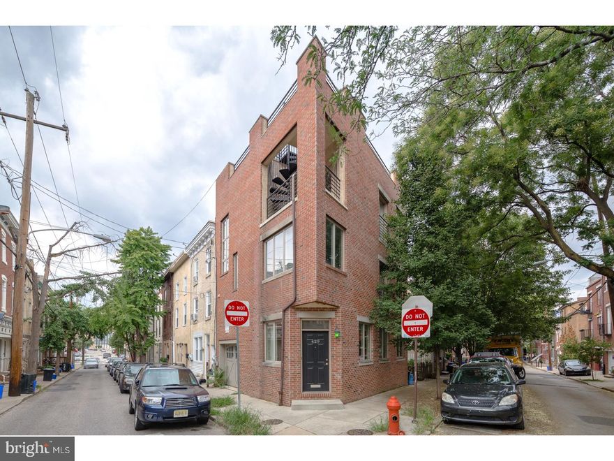 This beautiful 3 bedroom, 3-story with private 1 car garage, has a huge roof deck with panoramic views of Northern Liberties and Center City. Exquisite exterior corner facade with windows on 3 sides! Hardwood floors throughout, living room entrance, garage entrance. Lower level family room made for entertainment with plush wall to wall carpeting and a huge storage room under the garage. The kitchen has a breakfast nook with window views and access to slider doors overlooking the patio. Fully fitted kitchen with stainless steel appliances, granite counters, plenty of work space, and easy access to the patio for outdoor grilling. 2nd floor hall bath with marble tile, a beautiful wood vanity, and a large hall laundry room with side by side washer and dryer. The master bedroom suite is enchanting, filled with light, fitted walk-in closet, a private  bath, spa-inspired tile work with glass shower door. Access from the bedroom to a covered balcony and up to the roof top deck. Walking distance to dog park, Honey's Cafe, North 3rd bar, Standard Tap, Cafe La Maude and North Bowl. Easy to show, must see! We welcome your visit today.