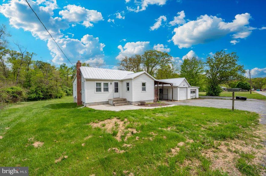 Country living with no HOA. Charming 2 bedroom, 1 bath cottage on just under an acre waiting for your personal touches. Eat-in kitchen with pantry and table space. This home features hardwood floors in the living room and dining room with fully carpeted bedrooms. The kitchen has a newer stove and recently updated countertops. Additional updates include: heat pump & a/c, water heater, water treatment system with UV light , in-line water filter, new well pump, and septic holding tank, replacement windows and freshly painted metal roof. No need to leave home to do your laundry; a washer & dryer are located in the basement. A covered patio keeps you out of the elements as you go to the 2 car garage. Enjoy the benefits of a level backyard for ease of outdoor living.  Being sold as-is, inspections are strictly for informational purposes only.