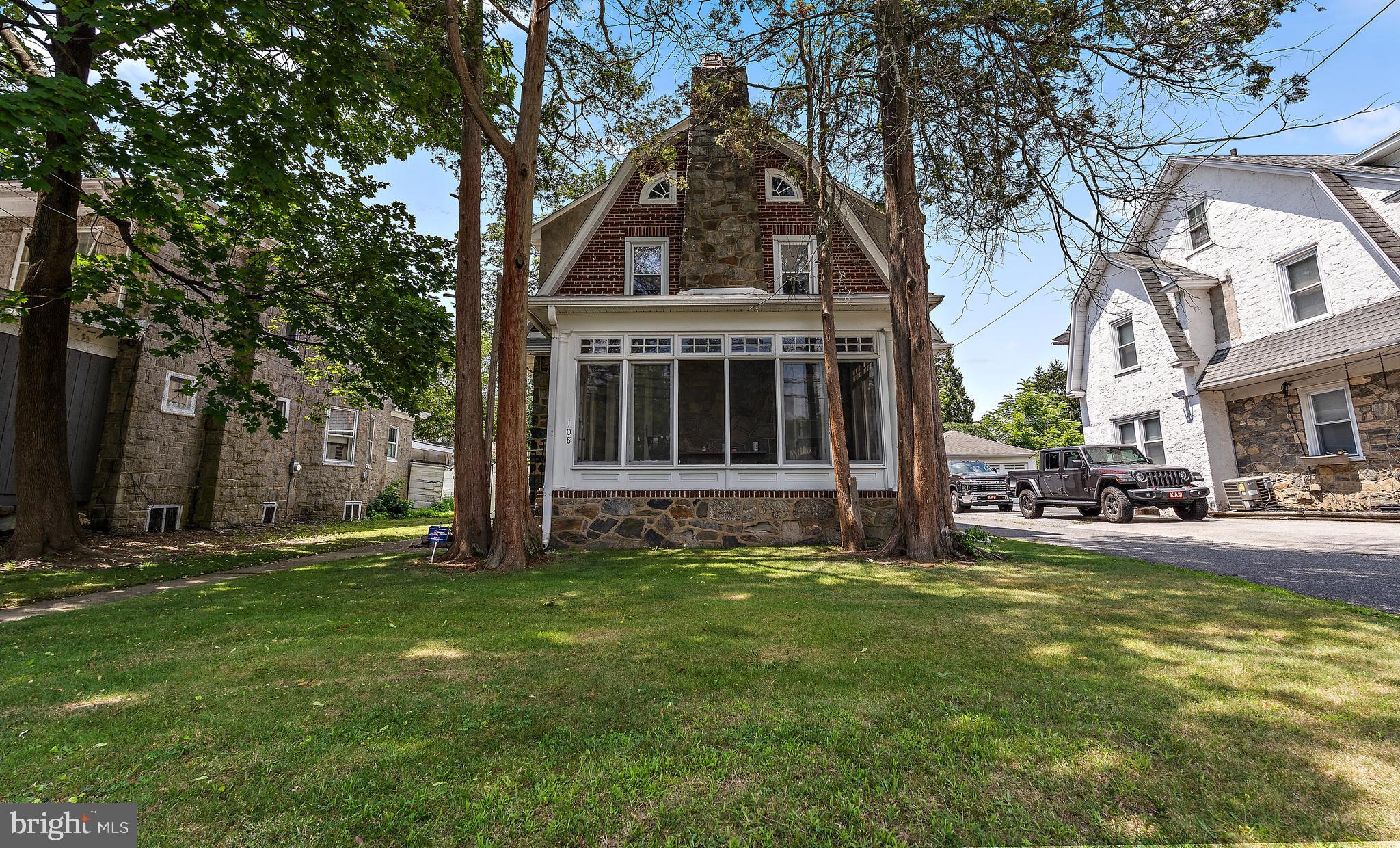 Welcome home to 108 E. Parkway Ave, a charming Dutch Colonial nestled on a peaceful street bordering Chester Park and Taylor Memorial Arboretum. Imagine relaxing on your gorgeous covered front porch, sipping your morning coffee while enjoying the serene surroundings. This delightful 3-bedroom, 1.5-bath home offers an incredible lifestyle at a fantastic price. Step inside and be captivated by the beautiful hardwood floors with intricate inlay design that flow throughout. The spacious living room, anchored by a striking stone fireplace, invites you to unwind. Entertain with ease in the large dining room, just off the kitchen, which boasts brand new granite countertops. A convenient powder room and ample closet space complete the main floor. Upstairs, you will find three comfortable bedrooms and a large hall bathroom. Plus, there is a full walk-up attic and an unfinished basement, providing endless possibilities for expansion or storage – making this truly feel like a place to grow and make your own. Outside, the fully fenced-in rear yard offers privacy and peace of mind, perfect for pets or play. A detached 2-car garage adds convenience and extra storage. Recent upgrades include a brand new gas heater, ensuring comfort and efficiency. With its prime location just a stone's throw from Edgmont Avenue and less than 2 miles from Routes 95 and 476, this home is a commuter's dream. Don't miss your chance to own this exceptional property – schedule your showing today!