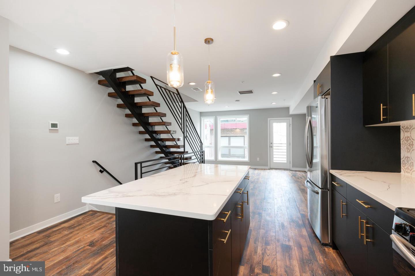 Available September 1st move in. This gorgeous 3 bed 2.5bath townhome was built in 2021 with ultra luxurious finishes. Featuring GARAGE PARKING, private roofdeck, and large open concept living within Perkiomen Courts; a 24 home community. The first-floor features an incredibly modern yet elegant kitchen with custom wooden soft close cabinets and a large kitchen island along with stainless steel appliances. An oversized living room area is right off the kitchen area. The floating staircase (which was fabricated onsite) takes you to the second level which has two bedrooms and a beautifully modern full bathroom. One the third level is a gorgeous master suite featuring a generous sized walk-in closet with built-in organizer, a huge bathroom featuring dual vanities and an oversized frameless shower stall! The spiral staircase takes you up to the roof deck which include beautiful view of the city skyline. The home includes attached garage parking which is accessed by the common area driveway for this community. There is a half bath / powder room as you enter the home though the garage. Conveniently located in the very desirable Fairmount/Francisville area and within walking distance to all Fairmount cafes, bars and restaurants. The Francisville park is around the corner and perfect for pet lovers. Close to the Ridge Ave corridor and the first ALDI superstore market in the country. Its a commuters paradise as well. Subway system is a few blocks away and your near the Art Museum, Center City, public transportation, shopping centers, cafes, bars, and restaurants.