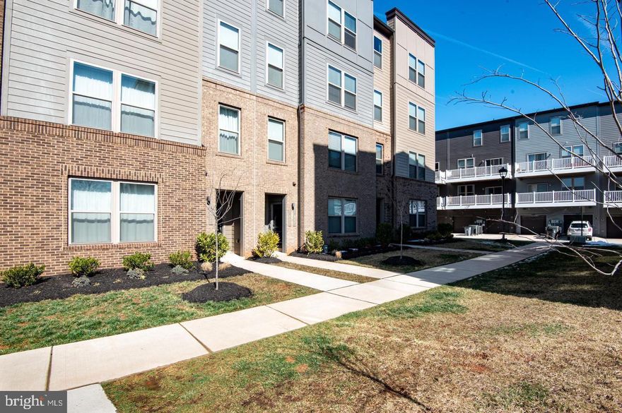 Welcome to your new gorgeous 2 level condo. Garage entry for easy access in and out. Main level boasts a gourmet kitchen and living room area. The kitchen is complete with an oversized island, double ovens and upgraded countertops. The upper level consists of a sunlit master suite with two walk in closets, and an updated master bathroom. There is an additional apple sized bedroom, full hallway bathroom, and a large bonus room with access to the upstairs balcony. This elegantly decorated property is quietly nestled within walking distance of shopping areas and restaurants and just a short drive to the VRE and all commuter routes!