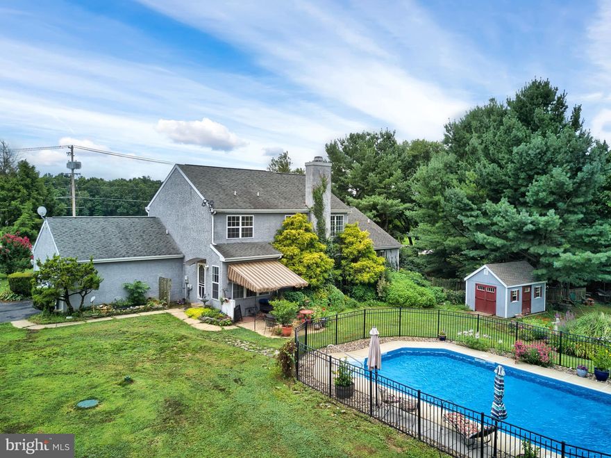 Don't miss out on this charming porch front Colonial situated on a large corner lot. The yard is spacious with plenty of room for the sparkling in ground pool as well as outdoor activities, The entry foyer is bright & light filled with a soaring 2 story ceiling that flows into the great room which features hardwood floors and a wood burning fireplace (which can be converted to gas) . The kitchen has a center island and breakfast area overlooking the beautiful backyard, and there's a "formal" dining area as well. The main level master bedroom is located on the opposite side of the house and has hardwood floors, a walk in closet and renovated ensuite bath. The main level also features a laundry room as well as a powder room.Upper level features updated carpet, 3 additional bedrooms and a renovated full bath. The lower level rec room is set up for entertaining and includes the pool table & all the accessories as well as the pellet stove. There's a generous sized utility/work room on the opposite side of the lower level plus a newer HVAC system & water heater. So many features...come see for yourself! Why not make this home yours today?