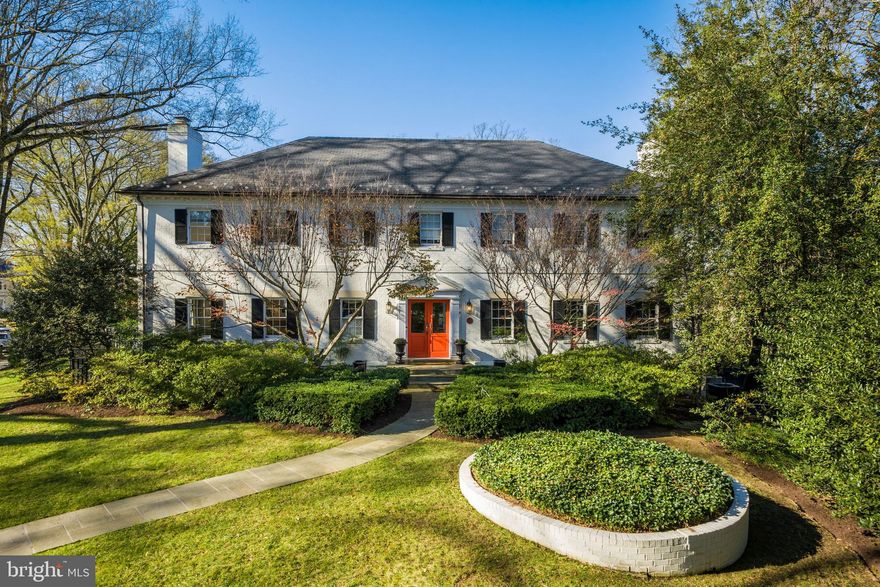 4925 Lowell Street NW is a beautifully designed brick Colonial in the coveted neighborhood of Kent that is perfectly situated on a large prominent corner lot. Offering 6 Bedrooms and 5.5 Baths throughout 3 finished levels, this sophisticated residence boasts considerable living spaces, custom details, and a floor plan suitable for generations to come. Spacious and bright, the main entertaining rooms are distinctly defined for a sense of formality, all while gracefully dovetailing for a modern layout. The interior living areas elegantly extend outside by way of the tranquil outdoor spaces that include a Side Porch, a Covered Porch, a wraparound Deck, and a Backyard. There is an attached 2-Car Garage that is discreetly placed at the rear of the home.  Charming double doors welcome you into the Foyer that is flanked by the formal Living and Dining Rooms. Accented with handsome dentil molding and gleaming hardwoods, these radiant rooms are flushed with natural light. Adjacent to the Dining Room is the stunning Kitchen that is home to a statement La Cornue range, custom cabinetry, paneled appliances, and a perfectly sized marble island. The Breakfast Room has built-in seating and a Coffee/Wet Bar with beverage refrigerators, marble counter and backsplash, and open shelving. A beamed ceiling and a wall of built-ins superbly highlight the Family Room that also has access to the wraparound Deck.   There are 5 Bedrooms and 4 Full Baths on the Upper Level, including an exquisite Primary Suite that encompasses a luxurious En-Suite Bath and two Walk-in Closets. There are two Bedrooms Suites with private Baths and two additional Bedrooms that share a Hall Bath.  The Walkout Lower Level has a Recreation Room that opens to the Backyard and that features a fireplace and a wall of built-ins. There is a Playroom/Bonus Room, Office, Bedroom, Full Bath, and ample storage on this level..