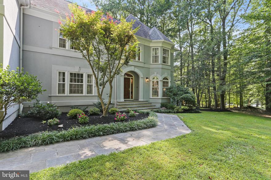 Extraordinary custom built home nestled on a breathtaking 3+ acre lot of the highly sought after Chapel Woods, offering an unparalleled living experience, combining privacy, serenity, and endless possibilities for relaxation and entertainment. Key features: 6 bedrooms, 4.5 bathrooms, and 3 car side entry garage. Awesome Outdoor Oasis - Enjoy a heated swimming/diving pool, extensive hardscape, fire pit, gazebo, deck, kids play area, and a huge usable front and backyard perfect for sports, gardening, and entertaining. Exquisite Architecture: The striking architectural details include hip roofs and multiple bay windows that frame stunning views from every angle. A bluestone walk path accented with flowering beds leads to a charming stone stoop and arched front porch. Grand Entryway: Step inside to a two-story foyer flanked by three sets of French doors, providing privacy for the main level library, living room, and formal dining room. Gourmet Kitchen and breakfast area: The renovated main kitchen is a chef's delight, featuring built-ins, floor-to-ceiling cabinets for ample storage, a center island, and new floor-to-ceiling patio doors and expansive bay windows showcasing panoramic views while you prepare or enjoy meals. Seamless Indoor-Outdoor Living: The family room, located off the kitchen and the breakfast area, features floor-to-ceiling windows and two sets of patio doors that open onto a large deck. Luxurious Primary Suite: A setback stairway leads to the gorgeous primary suite with tray ceilings and multiple windows for amazing views of the trees and crystal clear blue water in the pool, three additional bedrooms on the upper level, each with walk-in closets and awesome views. Versatile In-Law Suite: A separate staircase leads to a private in-law suite, including a fifth bedroom, a sizable walk-in closet, a third full bathroom, an updated kitchen with new quartz countertops, energy-efficient appliances, LED ceiling lights, and an oversized media room with multiple windows. Entertainment Haven: The top level offers a massive attic rec. room with 3 skylights – a hidden hideaway, a cozy clubhouse, and a whimsical retreat that kids love.  A separate door leads to a dedicated movie theater – perfect for family entertaining. Finished Lower Level: The beautifully finished basement presents a 6th bedroom, a 4th full bathroom, another multi-functional recreation room with a wet bar, a game room, a spacious home gym/dance studio, and a large storage room. Modern Conveniences: Multiple media rooms are ideal for work-from-home, learning, project exploration, and entertaining. The entire house is equipped with a Bose surround sound system, offering various facilities for luxurious living. EV charger in the 3 car side entry garage. Super convenient location: within one mile to River Hill schools, while a convenient bus stop at the end of the driveway serving all grades. The Chapel Woods community enjoys the easiest commuting "Against the Grain" Traffic: driving in the opposite direction of the "rush" (the crowd), to the River Hill Elementary and High Schools, minutes to River Hill Village Center, Clarksville Commons, fine restaurants, grocery stores, farmer’s markets, professional and medical services, easy access to 32//29/95, Columbia, Rockville, D.C., Baltimore, and Annapolis.
•