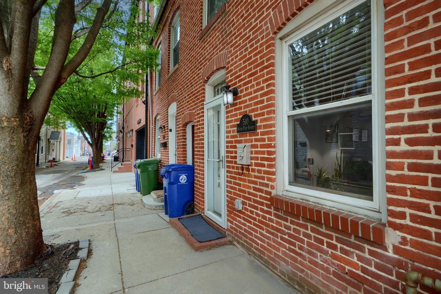 Location is important, and this one is perfect for Park enthusiasts while offering easy walkability to all the local amenities that Canton, Fells Point, and Patterson Park have to offer. This tree-lined street has cute string lighting, which gives a feeling of serenity. In addition, the home offers an open concept living, dining space, half-bath, and eat-in kitchen leading to the spacious rear yard. The upper level offers 2 bedrooms and a full bath with a tall ceiling and tons of natural light, with the home having 13 windows. The rear bedroom has a rear exterior door that leads to your future roof deck. Some new features in this home are new HVAC, hot water heater, and front storm door. Come and enjoy the character this home offers, and with some adjustments, this could be a wise investment.