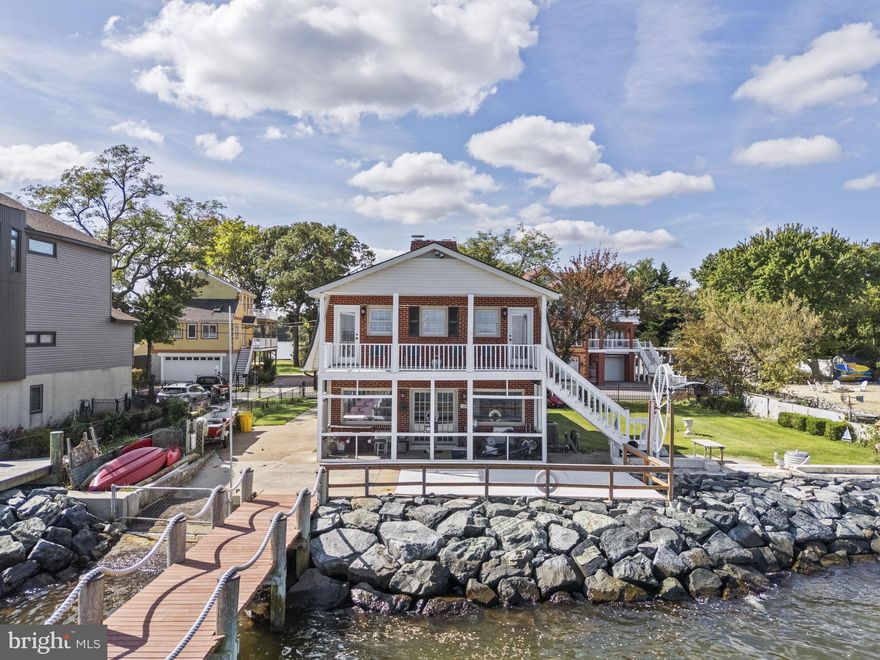 Stunning waterfront property offering 3 bedrooms and 3 bathrooms, with sweeping views of the Chesapeake Bay and Boyd Pond from every room. 90 foot pier equipped with water, electricity and a boat lift. The upper-level porch, accessible from both the primary suite and second bedroom, provides elevated Chesapeake Bay views. Inside, the waterfront family room opens to a screened-in porch and patio, highlighted by a dramatic stone fireplace. Three additional fireplaces are located in the kitchen, living room, and primary bedroom, creating warmth and charm throughout the home. The second and third bedrooms are connected by a Jack-and-Jill bathroom, while hardwood floors span the upper level and durable laminated flooring enhances the main level. Photos coming soon! 
Rental Requirements: Applicants must have a minimum credit score of 640, verifiable income of at least three times the monthly rent, a clean background, and a strong rental history.