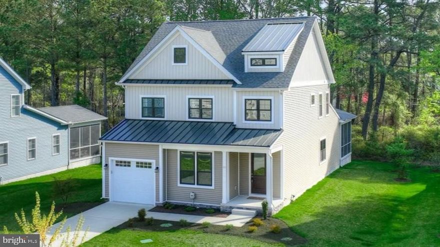 Enjoy the best of beach and canal living in this beautifully crafted coastal retreat, tucked near the back of the community of Stingray Harbor for added privacy, yet just minutes from Bethany Beach and the Boardwalk. Enjoy easy access to local restaurants, mini golf, ice cream shops, walking trails, and kayaking along the Assawoman Canal, all while coming home to a peaceful, tree-lined setting.

Built in 2023, this home offers 5 bedrooms and 4 full bathrooms, providing the space and flexibility today’s buyers are looking for. The main level features a spacious owner’s suite with a tray ceiling, generous walk-in closet, and spa-inspired bathroom complete with dual vanities and a striking Roman walk-in shower. An additional first-floor bedroom and full bath provide ideal accommodations for guests, while a well-appointed laundry room with a utility sink and folding counter adds everyday convenience. Upstairs, a bright and versatile loft connects three additional bedrooms and two full bathrooms, including a convenient Jack-and-Jill layout.

The heart of the home is a light-filled great room designed for gathering and entertaining. Expansive windows and a sliding door create a seamless connection to the outdoors, while the gourmet kitchen is appointed with quartz countertops, a large center island, a gas range, a deep apron-front sink, a tiled backsplash, a walk-in pantry, and abundant cabinetry.

Step outside to a screened porch and beautifully hardscaped patio overlooking the spacious backyard, surrounded by mature trees, an inviting space for outdoor dining, morning coffee, or unwinding after a day at the beach.

Located in the desirable community of Stingray Harbor, residents enjoy access to scenic walking trails and paddleboarding or kayaking along the canal. A quick bike ride brings you into the heart of Bethany Beach, where shopping, dining, and sandy beaches await.

Move in, settle back, and start living the coastal lifestyle you’ve been waiting for. Offered fully furnished, this home delivers a truly turnkey experience.