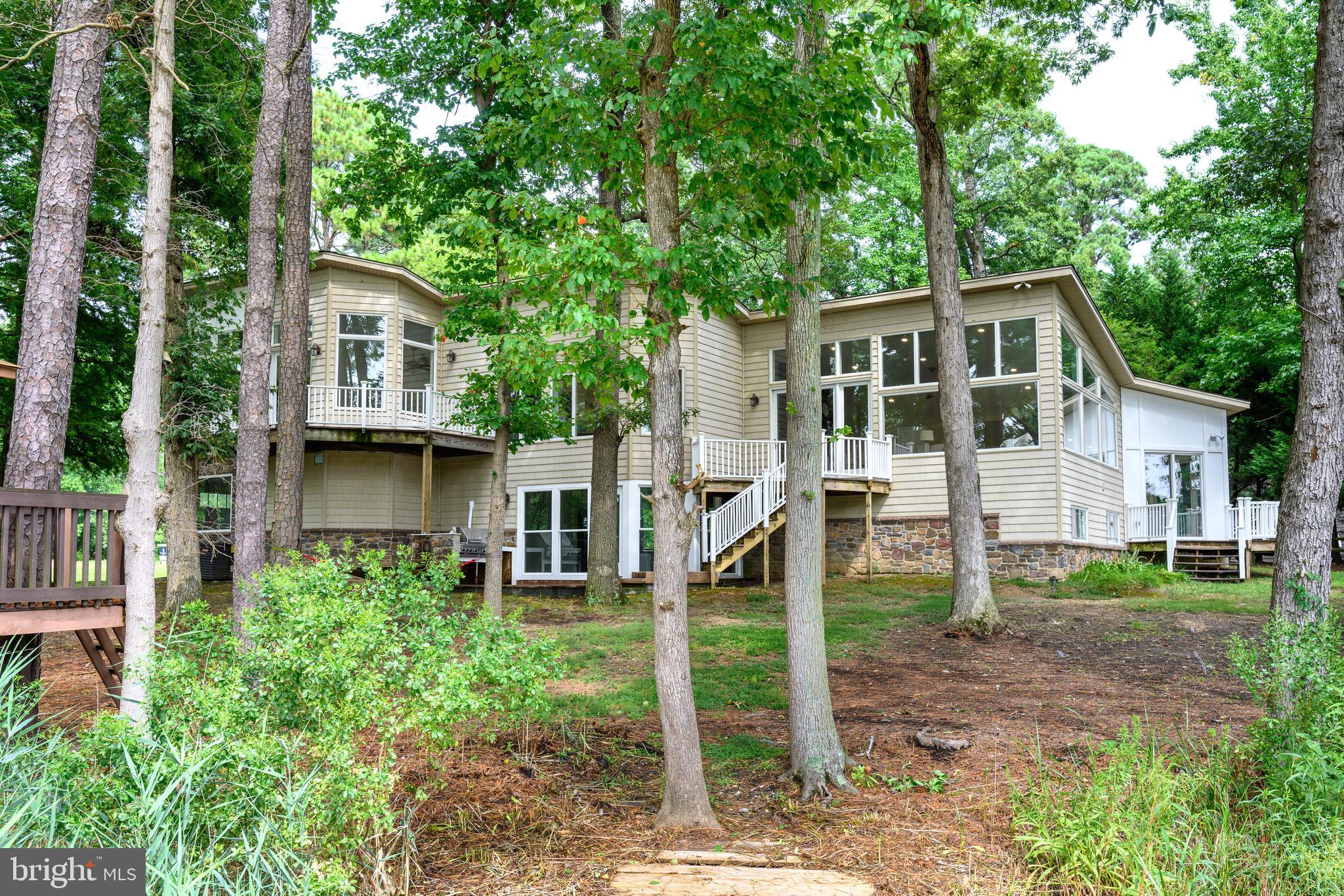 Waterfront Living at Its Finest!
This beautifully renovated home offers stunning water views from most rooms, creating a serene retreat filled with natural light. The gourmet kitchen with breakfast area flows seamlessly into the dining room and spacious living areas, perfect for both entertaining and everyday living.
Inside, you’ll find four bedrooms, two full baths, and two half baths, along with hardwood floors throughout most of the house, vaulted ceilings, and two fireplaces adding warmth and charm. A versatile sunroom/playroom with heat and air opens directly to the outdoor space, extending your living options year-round.
Enjoy the outdoors from your private pier on Shipping Creek, complete with a boat lift, or watch the abundant wildlife from the comfort of your oversized living space with large windows providing much light to look at rivers and trees and much more. Kayak, fish, or simply relax by the water’s edge.
The property also includes a two-car garage, expansive windows that showcase the view, and thoughtfully designed spaces that balance elegance with comfort.