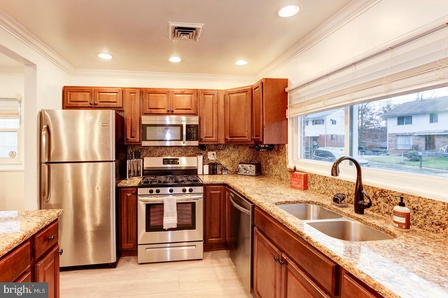 Wonderfully Renovated in 2014, this fabulous 3 Bedroom, 1 Full, and 1 Half Bath home with a large, partially fenced backyard and spacious concrete back patio. Ready to move in today! 3 bedrooms and 1 Full and 1 Half Bathrooms on 2 levels! New Carpet on the top level. Freshly painted bedrooms. Newer windows. Gorgeous blonde, engineered hardwood floors on the first level. The gourmet kitchen features rich granite counters, upscale cabinetry, crown molding, recessed ceiling lights, and designer pendants over the kitchen bar area. An extra storage shed in the backyard conveys and offers the new buyer extra storage options. The large backyard offers the new Owner many leisure and space options, from outdoor BBQ's, picnics, or even a separate pop up gazebo or pergola for outdoor entertaining.