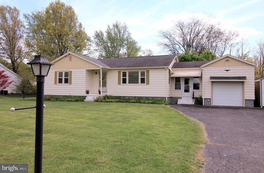 Priced to sell, this 1955 home boats many original features including original hardwood floors, the original farm sink and countertops, and original 3-light entry door. Enter into the huge eat-in-kitchen with gorgeous views of the backyard, stream, and farmland beyond. The kitchen has its original layout with white porcelain farm sink, 1950s countertops and solid wood cabinets. A large arched entry leads to the spacious living room with original hardwood floors and picture window. The hardwood floors continue throughout the bedrooms. The freshly painted master bedroom is bright and spacious. The next bedroom is large and contains a spacious closet and built-in cabinets. The third bedroom is carpeted. Room for storage is everywhere with a full basement with washer and dryer included, walk up attic with floor, and storage loft in the attached garage via the breezeway. Easy 2 minute drive to the new St. Lukes hospital, 5 minutes to 476 entrance, the area' premier Veterinary Hospital a minute away, and Target, Wawa and all the conveniences 5 minutes away. All this an you'd never know it sitting in your serene and beautiful backyard. There are few single family ranchers in this price range, so it will go quick!