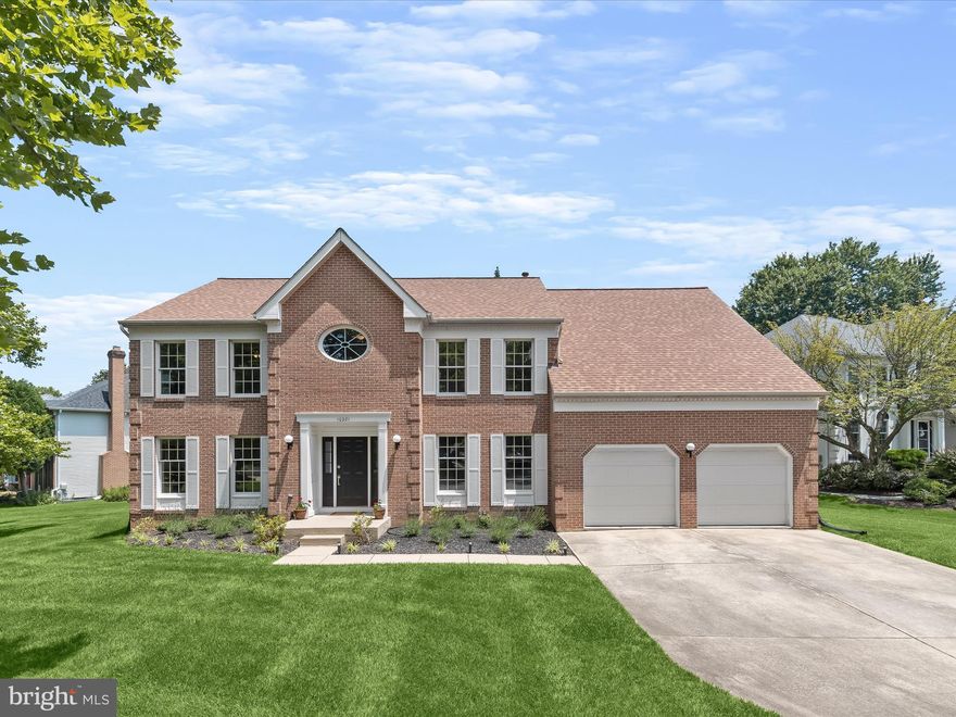 Experience luxury living in this stunning brick front Colonial, perfectly situated on a premium lot with a host of updates including a finished basement (2021),  renovated kitchen (2017), flooring (2007, 2010), primary bathroom (2012),  roof, (2017), 2-zone HVAC (2013), water heater (2023), whole house fan (2019) , stand-by 20KW whole house generator (2012), Trex deck (2018),  Simplisafe security system (2023) and more!  Enter into the bright and airy foyer highlighting black granite tile flooring, leading to formal living and dining rooms adorned with accent molding and elegant bamboo flooring upgraded throughout the main level. The impressive 2-story family room features a soaring vaulted ceiling, atrium windows, and a gas fireplace with a sophisticated white marble surround.  You'll love preparing your favorite meals in the fully renovated kitchen boasting high-end cabinets, a glass-paneled bar with inset lighting, upscale Bosch appliances, and a custom European-style painted glass backsplash.  A home office, laundry room, and powder room are conveniently located on the entry level.  Retreat to the spacious primary bedroom suite, which offers a huge walk-in closet with an oval window and a luxurious en suite bathroom updated with 18-inch marble tile flooring, a new vanity, a separate shower, and a heated towel rack. Two additional bedrooms are joined by a dual entry full bathroom and the fourth bedroom includes its own private bathroom.  The finished basement provides versatile spaces for games, hobbies, and exercise, along with two storage rooms and a home theater equipped with custom in-wall wiring for 7.1 channel surround sound, HDMI, and co-axial TV/antenna cable.  Outside, the expansive Trex deck is perfect for entertaining, while taking in the serene views of mature shade trees on this beautifully landscaped lot.