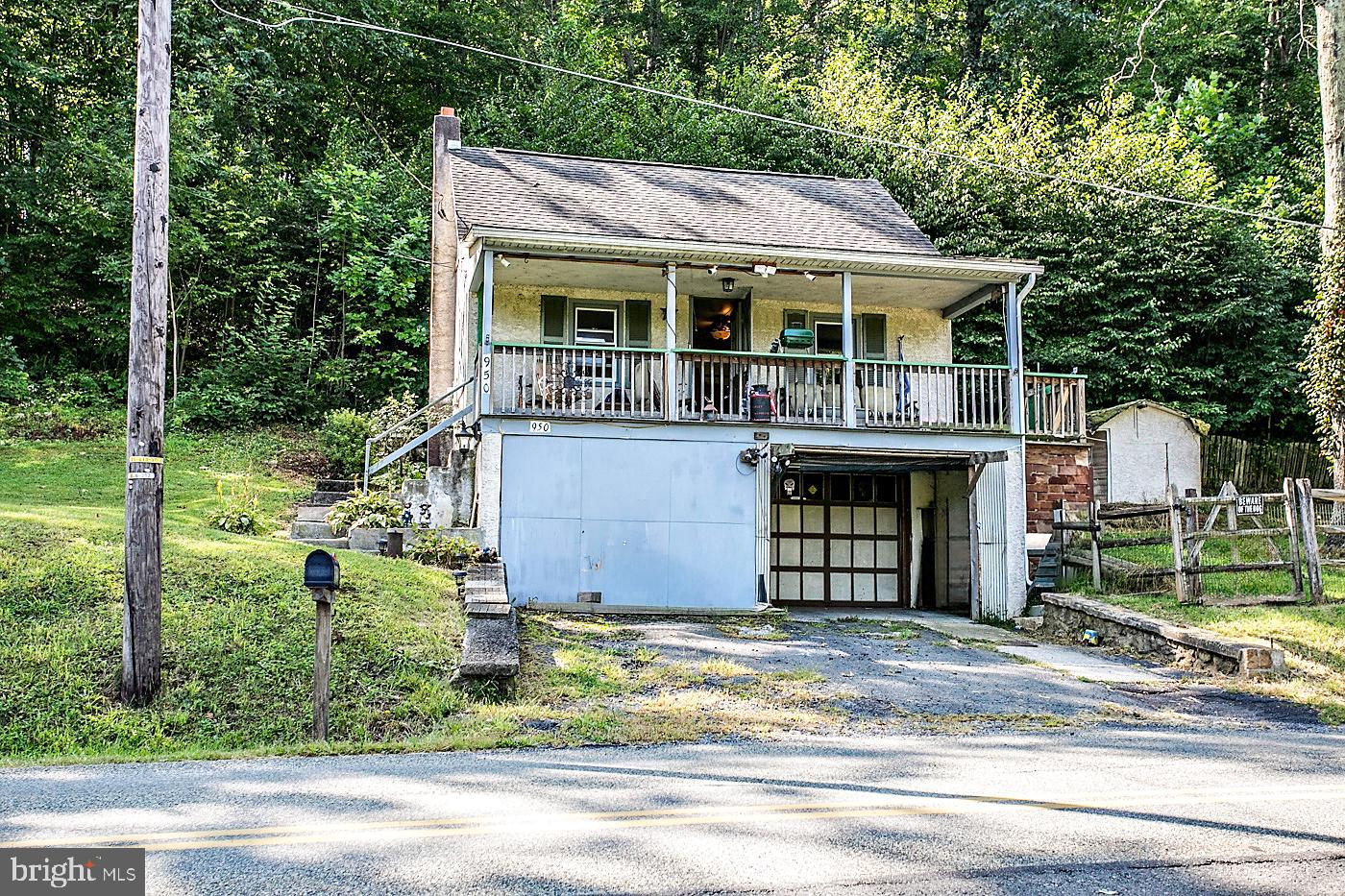 Opportunity knocks with this 3-bedroom, 1.5-bath Cape Cod. Nestled into a peaceful hillside setting, it offers a unique opportunity for buyers looking to build equity or create your dream home. Inside, you’ll find a welcoming living room, eat-in kitchen perfect for casual meals , and the convenience of main-floor laundry. Upstairs is the primary bedroom and a 2nd bedroom, both with access to a half bath. There is an additional room, which can be used as a 3rd bedroom or bonus room. The front porch offers a fantastic spot to take in the views. There is also a fenced-in area, basement with great storage, a 1-car garage and driveway parking for two. The location provides a cozy retreat feel, yet you’re just minutes from amenities. While the home needs some TLC, it’s brimming with character and possibilities. So, bring your vision – this could be your next great investment!