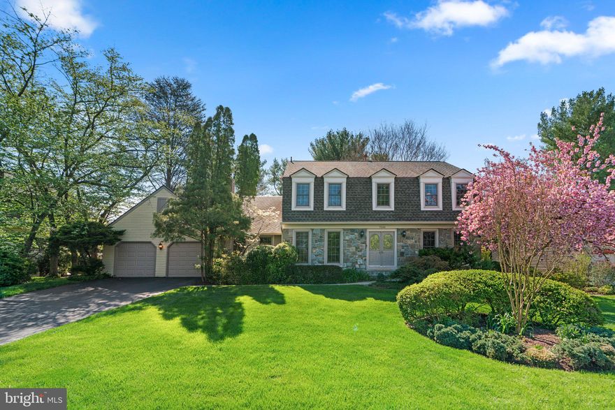 Nestled in the heart of the highly desirable Al Marah community, this magnificent colonial home stands as a testament to meticulous care, having been lovingly maintained by its original owner since it was constructed. This home is perched on a beautiful, flat homesite of over 1/3 acre, boasting the serenity of mature shade trees, gorgeous koi pond, a gazebo, and professionally landscaped gardens, creating a tranquil oasis in the midst of suburban bliss.

This stately residence offers an abundance of space and luxury, with 5 generously-sized bedrooms and 4.5 bathrooms spread over 5,000 square feet of living space. The oversized garage provides ample parking and is a true two-car garage with room to spare. A large storage area adjoins the garage and is equipped with double doors to the exterior.

As you step through the front door, a large inviting foyer welcomes you, flanked on one side by a private office space with double French doors and a spacious living room on the other. Hardwood floors flow throughout the first floor, and the heart of this home lies in its beautiful kitchen and breakfast nook which opens seamlessly to a large dining room. The grandiose dining room measures approximately 13' x 22' and is adorned with a charming wood-burning, floor-to-ceiling stone fireplace, vaulted ceiling, and wet bar. Just steps down from the dining room and breakfast nook is an incredible 30' x 23' family room, which was part of a spectacular two-story addition to the property. It's an entertainer's dream, complete with a cozy gas fireplace, tray ceiling, and drenched with natural light from the abundance of windows. The enclosed patio off the family room is a perfect spot to read a book and enjoy a cup of coffee while soaking up the sunlight.

The owner's suite features a sitting room and a private upper level deck, offering a scenic view of the backyard, complete with a gazebo and koi pond. Four more generously sized secondary bedrooms are served by two hall bathrooms and provide ample accommodations for family and guests.

The basement of this remarkable home offers a haven of its own, with a spacious rec room equipped with a wet bar, an exercise room, a second office for work or study, and even a cedar-lined storage room that measures approximately 13' x 8'. This beautiful property is ideally situated inside the beltway, with easy access to DC, Virginia, three major airports and within the Bannockburn, Pyle, and Whitman school districts.