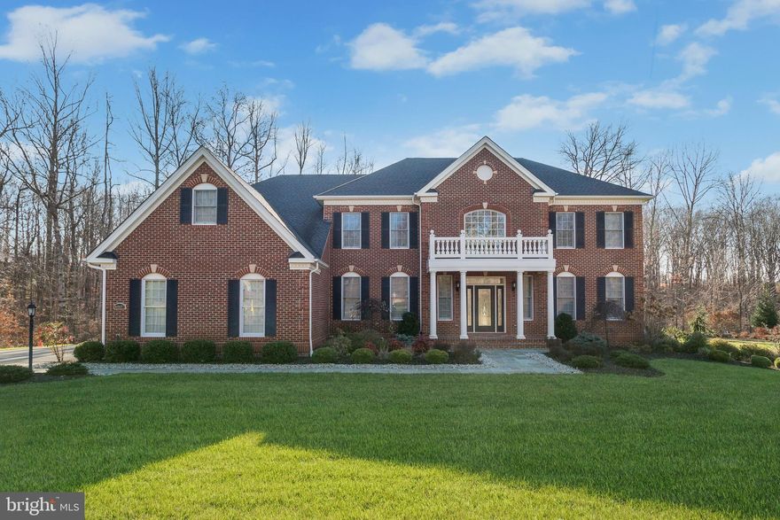 OFFER DEADLINE SUNDAY, 1/30/22  AT 6PM.   Built by Toll Brothers, this stunning residence is situated on a lovely cul-de-sac backing to trees.  Welcome guests with a bluestone walk lined with professional landscaping, commencing on beautiful a rectangular portico covering an eight-foot leaded glass entry door.  Inside, arrival is celebrated with a grand two story foyer, and two sweeping curved staircases sided by living and dining formals embellished with tray ceilings and contrast wainscoting.  The extended foyer is punctuated with four columns while it unfolds to the formal study, and a dramatic two-story great room. Outstanding features include a soaring coffered ceiling, gas fireplace, hardwood floors throughout the main level, and a secondary back stair.   The hallmark chefs kitchen is at the heart of the home and has adjacencies from the great room, dining room, butlers service pantry, breakfast room, and Trex deck.  With upgrades including 42 cabinetry, granite counters, decorative backsplash, and professional stainless steel Monogram appliances, commanding center entertainers island offers a prep sink and breakfast bar.   Upstairs, the gracious open landing is embellished with iron balusters overlooking the foyer and the great room. Luxury living is fully expressed in the Owners suite beginning with French doors opening into a spacious den and sitting room. A two sided fireplace seamlessly transitions from the sitting room to the suite bedroom.   A deep tray ceilings accents the bedroom area while a pair of French doors open to a sumptuous spa-like bath featuring separate vanities, soaking tub, decorative accent tile, and walk-in shower.  Completing the Owners suite is a walk-in dressing closet, and a second, hallmark bonus closet boasting more than enough space for the most extensive wardrobe. Three additional en-suite bedrooms complete the upper level.  Outside, enjoy the comfort, privacy and beauty of outdoor living on a spacious, low maintenance Trex deck overlooking a lush green lawn fringed with trees. Come home to uncompromising quality, comfort and better than new luxury amenities at every turn. Simply immaculate!