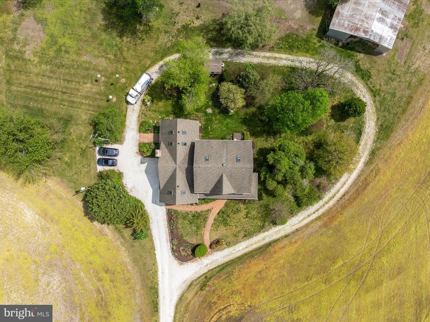 Back on the Market due to Buyer's FSA financing falling through. 

SELLER NOW OFFERING A $20,000 CREDIT TOWARDS FRESH PAINT & NEW CARPET. Welcome to Thanksgiving Farm, an exceptional opportunity to own nearly 100 acres of prime Eastern Shore farmland just minutes from charming small towns and within easy reach of Ocean City, Annapolis, and major airports. This versatile estate includes two parcels – one is a separate, buildable 13.81-acre lot, offering future flexibility or potential multi-generational living. Tucked at the end of a long private drive, the main home is a thoughtfully designed farmhouse that perfectly blends classic charm and practical living. The home features four spacious bedrooms upstairs, including a private primary suite with a sitting area, large bathroom, and direct access to a massive bonus room – perfect for a home office, yoga studio, sewing room, or playroom. The bonus room also has its own private staircase, making it a truly flexible space. On the main level, enjoy hardwood floors throughout, a light-filled kitchen that opens to a casual dining area and cozy family room with a wood stove. Just off the family room, a large screened-in porch overlooks the property’s picturesque fields, gardens, mature trees, and classic barn. A formal living room and dining room round out the main level, ideal for gatherings and entertaining. There’s also a convenient first-floor bedroom. The unfinished attic—with walk-up stairs, windows, and skylights—offers the potential for a bunk room, office, or gym, while the walk-out basement is ideal for a workshop or storage and connects directly to the attached garage. Outdoors, the land itself is the true star. Of the 99.81± total acres, approximately 70 are tillable—ideal for row crops or converting to a regenerative farm. Several low-lying areas create opportunities for duck ponds or managed impoundments. The remainder of the property is wooded and absolutely teeming with wildlife—whitetail deer, turkey, and more—making it a hunter’s paradise. A large equipment shed offers ample space for tractors, ATVs, RVs, boats, and anything else you can imagine. Whether you’re looking to work the land, create a multigenerational retreat, or simply unwind in the heart of Maryland’s farm country, Thanksgiving Farm offers endless possibilities.