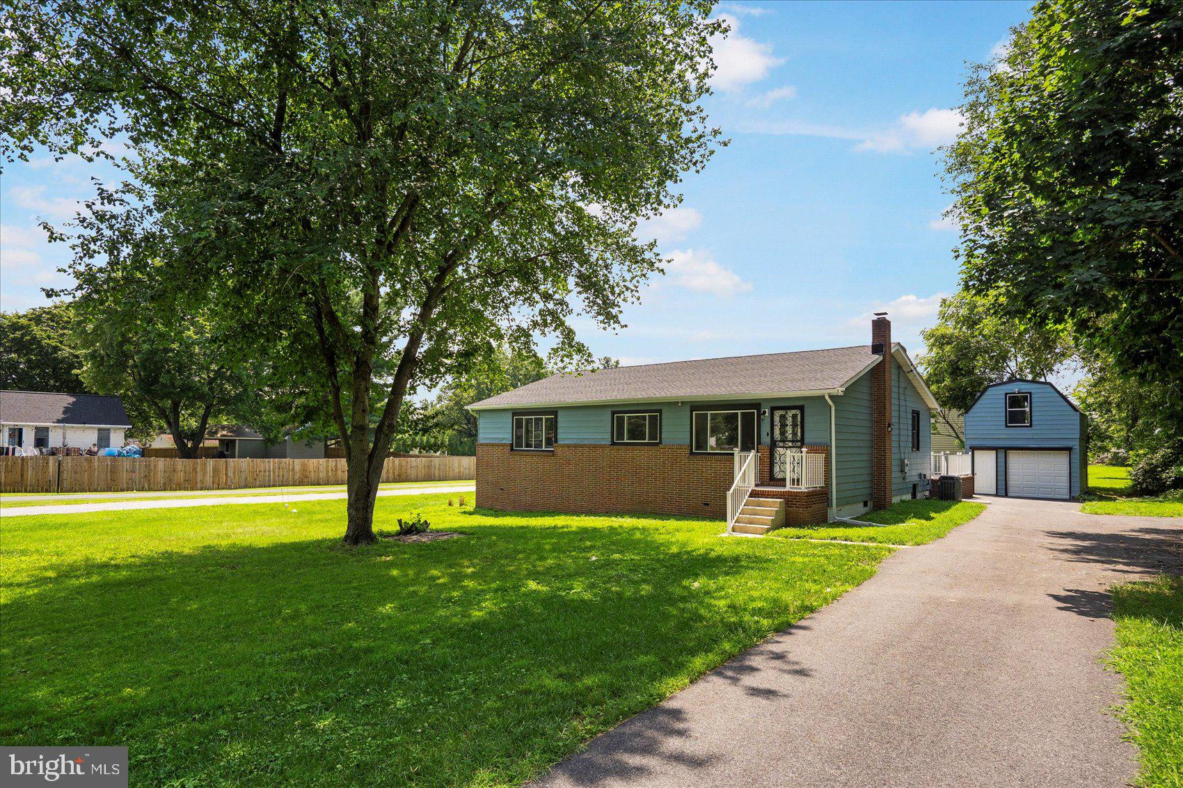 Come tour this beautifully renovated and rarely available rancher with COASTAL VIBES on a half acre lot in White Marsh! This home is not like anything you have seen before and is 1 LEVEL LIVING at its finest! It has all the bells and whistles and everything you could want and more! New roof on the main house and the garage, freshly painted siding, a brand new MASSIVE 30' x 22' deck off the rear of the home with 2 interior access points, and a 2 level detached garage with new garage door, electric and 2nd level work or storage space! The long driveway can also fit an additional 8 - 10 cars! Step inside the home which has NEW light colored wide plank LVP flooring, super fresh and sleek paint colors throughout, and tons of windows that let in loads of natural lighting. The kitchen was remodeled with Hunter Green Cabinetry, a Shiplap Backsplash, Matte Black Hardware, Dora Quartz Countertops, and all new High End GE Black Stainless Steel appliances. There are 3 spacious bedrooms with all new plush carpeting and 2 full and 1 half remodeled bathrooms. The primary suite is incredible with not one but TWO walk-in closets and ceiling fans, and a spa-like ensuite bathroom that is light and bright with a custom standup shower, soaking tub, and double sink vanity with quartz tops. You can also access your rear deck directly from the primary suite as well! Homes like this one don't hit the market every day. Stop your search and schedule a tour today!