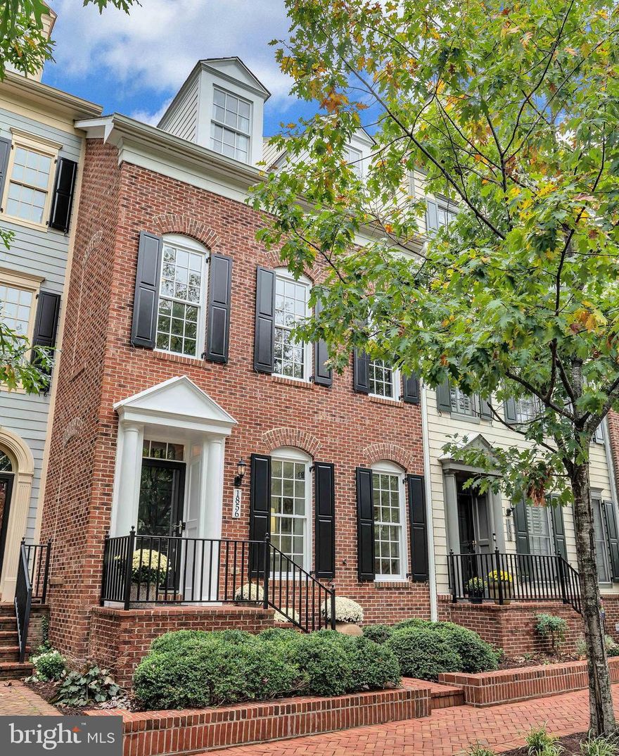 A beautifully appointed three-level townhome offering timeless architectural details, warm hardwood flooring, and thoughtfully designed living spaces, with over $116,000 in updates.
The entry level welcomes you with a versatile recreation room and a study, thoughtfully separated by interior transom-style windows that allow natural light to flow between the spaces while maintaining definition. This flexible layout is ideal for a home office, library, fitness area, or guest overflow. A renovated powder room enhances functionality, creating the perfect balance of comfort and convenience for today’s lifestyle.
Upstairs, the main living level is elevated by rich hardwood floors, extensive crown molding, recessed lighting, and an inviting open layout. The elegant staircase showcases crisp white balusters, and contrasting dark handrails, adding architectural character and visual interest.
The kitchen seamlessly connects to the breakfast area and family room, blending warmth and sophistication. Neutral tones create a serene backdrop while refined finishes make a statement. Highlights include an elongated center island with breakfast bar seating, rich wood cabinetry, Silestone countertops and backsplash, and a chef’s sink with grid rack and modern pull-down chrome faucet. A striking starburst lighting anchors the breakfast area, while the adjoining family room features a dramatic double-sided gas fireplace with a sleek honed stone surround. Kitchen updates were completed between 2015 and 2020.
The spacious dining area is illuminated by a mid-century inspired chandelier and flows through an open-concept dividing wall into a grand living room with oversized windows overlooking tranquil wetlands, creating a beautiful connection to nature.
The upper level serene owner’s suite featuring hardwood floors, two custom closets, an Altus ceiling fan, modern blackout shades, and space for a seating area. The spa-inspired ensuite bath, fully remodeled in 2018, showcases a marble-topped dual vanity, framed Gabby mirrors, a soaking tub, and oversized floor tile that grounds the space with a clean, modern aesthetic. The walk-in shower is appointed with a porcelain surround and backsplash, frameless glass enclosure, large showerhead with hand sprayer, and refined fixtures, creating a true spa-like experience. A Toto commode and frosted window enhance both comfort and privacy.
Two additional upper-level bedrooms offer warmth and architectural appeal with hardwood floors, statement lighting, and a cozy window seat perfect for reading or relaxing. The secondary full bath, also remodeled in 2018, continues the spa-like aesthetic with classic white subway tile, built-in niche, polished chrome fixtures, rain-style showerhead, and timeless penny tile flooring.
Every detail has been thoughtfully curated from crown molding and trim work to lighting and finishes creating a home that blends classic elegance with modern comfort across all three levels.
The finished oversized two-car garage was freshly painted in 2026, offering clean, functional space for both parking and storage.
Located within the highly sought-after Potomac Greens community, residents enjoy exceptional convenience to Amazon HQ2, the Virginia Tech Innovation Campus, and Potomac Yard Metro.