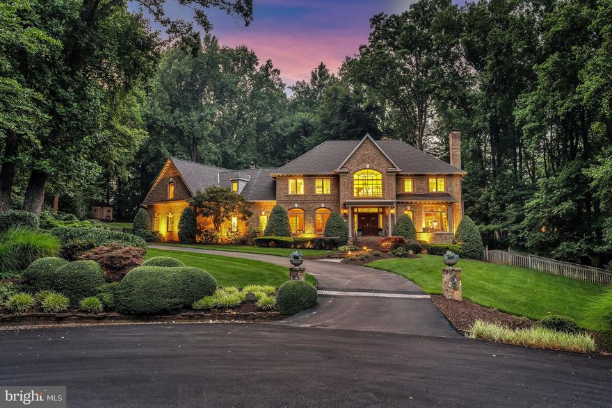 Sitting amongst gently rolling knolls and surrounding trees, this residence offers both privacy and a warm community feel.  Sited on 1.9-acre, this cul-de-sac lot captures an abundance of afternoon sunshine with a southwestern exposure and offers a fabulous entertaining deck that spans almost the full width of the house looking out the gorgeous backyard amenities including a putting green and a sparkling pool. The lavishly appointed main level features an arched entryway to the generously sized rooms, rich moldings, a sunroom with walls of windows, three fireplaces and a library with built-in bookshelves.
The upper-level offers 4 ensuite bedrooms including the owner’s suite with massive walk-in closet and large spa-like bathroom.   An expansive walk-out lower level provides numerous spaces for all your recreational needs.  This exceptional residence has a welcoming flagstone and brick front walkway, gorgeous landscaping, large and private backyard and an oversized sideloading three-car garage.