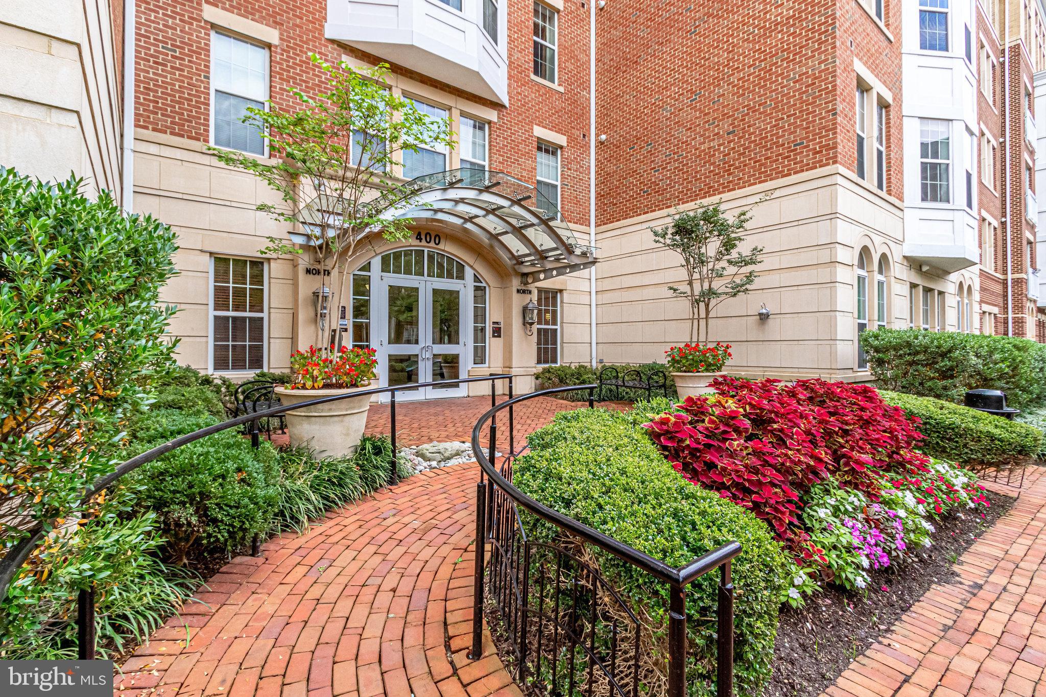 Sunny, stylish, and move-in ready — this 2-bedroom, 2-bath condo in Alexandria’s Cameron Station combines modern upgrades with a prime location. A wall of windows brightens the open floor plan, while the chef’s kitchen shines with granite countertops, a stylish tile backsplash, updated stainless steel appliances, under cabinet lighting, and a breakfast bar perfect for casual dining or entertaining. Durable wide-plank hardwood floors flow throughout, and the desirable split-bedroom layout offers privacy—ideal for guests or a roommate. The spacious primary bedroom features an ensuite bath with dual vanities. Step out to your private balcony overlooking the peaceful courtyard, perfect for enjoying morning coffee or an evening glass of wine. Additional features include an in-unit washer and dryer, two assigned underground parking spaces, and access to a secure package room, bike storage, and a well-maintained building with elevator access. Enjoy all the Cameron Station amenities: outdoor swimming pool, state-of-the-art fitness center, community center, and scenic trails. You’re just minutes to Old Town Alexandria, Shirlington, the Pentagon, and Washington, D.C., with easy access to I-395, I-495, and the Van Dorn Metro (with a community shuttle during rush hour). Move-in ready with major updates already done: HVAC (2024), washer/dryer (2024), and refrigerator (2024).
