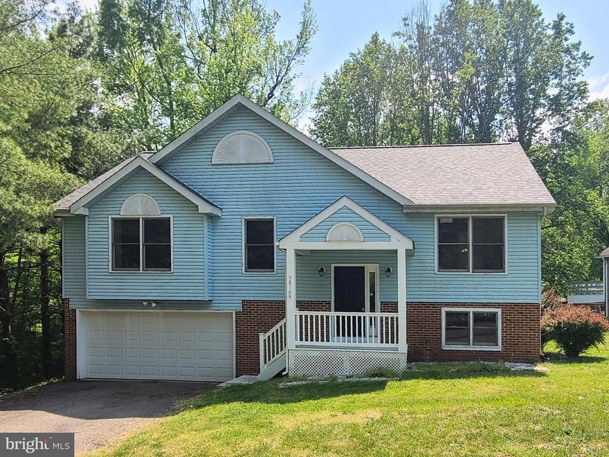 Lovely 4 BR, 3 full BA home in Sheraton Oaks with attached garage.  The home is situated on a tranquil lot that backs to woods, with a relaxing shallow creek that runs along side.  The yard creates a peaceful space for anyone to enjoy.  This home has approximately 2289 finished SF and features a brand new roof, cathedral ceiling, beautiful flooring, kitchen with peninsula, and dining area with a great view.  The MBR has a luxury bathroom with jetted tub and double sinks.  In the lower lever is a huge family room w/ brick fireplace, the 4th BR, and full BA.  Close to dining, shopping, commuting options, and Historic Downtown Fredericksburg.