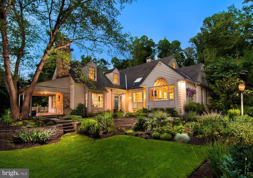 Nestled in the heart of Radnor Hunt, this extraordinary property offers a rare opportunity to own a home of unmatched character and charm. Situated on 4.3 breathtaking acres, complete with a picturesque pond and stunning gardens, this meticulously-maintained residence seamlessly blends classic architectural details with modern amenities. From the moment you step into the light-filled foyer, you are welcomed into a home designed for both comfort and sophistication. The expansive kitchen and breakfast room, adorned with bay windows and abundant natural light, create a bright and inviting space. A gas fireplace with a stone surround adds warmth, while glass doors open to outdoor living space, including a beautiful covered porch overlooking the serene pond. Just beyond the covered porch sits a beautiful patio - perfect for al fresco dining.  A deck off of the kitchen is also accessible from the great room, and the formal dining area as well, providing a wonderful flow from indoors to the bucolic outdoor setting.  A grand opening, framed by reclaimed barn beams, leads into the magnificent two-story great room, where a floor-to-ceiling wall of historically inspired exposed stone serves as a striking architectural highlight. French doors provide access to the outdoor living space, while skylights and charming window seats enhance the ambiance of this room and are perfectly positioned flanking the gas fireplace on either side. The open floor plan flows beautifully into the spacious living and dining areas, both bathed in natural light and designed for entertaining. A glass-enclosed porch extends the living space, offering a tranquil retreat to take in the breathtaking views. The first-floor primary suite is a private sanctuary, featuring a large bay window with stunning water views.  Architectural details such as rounded walls and reclaimed beams, implemented by Archer & Buchanan, add a unique character to this inviting space. A spacious walk-in closet outfitted with built-in drawers and shelves provides an abundance of space for all wardrobe needs. The luxurious primary bath is spacious and illuminated by a generous skylight and large picture window offering breathtaking scenery to enjoy. The radiant heated floors provide an extra level of comfort. Upstairs, a loft area—perfect for a home office, playroom or additional bedroom-is complete with built-ins and skylights, enhancing its functionality. A striking suspended walkway overlooking the great room leads to three additional bedrooms, and two full baths to service this area of the home.  One of the bedrooms is en-suite and also boasts a roomy walk-in closet. This remarkable home includes dry-set stone walls and vibrant gardens.  Some of the beautiful species you will find include hydrangea, daffodils, iris, a climbing clematis on arbor and so much more.  For added delight, mature crepe myrtles adorn the property and a spectacular magnolia makes a statement at the flagstone walkway leading to the entrance. Additional features include a two-car detached garage with attached potting shed, a 4,000+ bottle wine cellar, a whole-house generator, and gleaming hardwood floors throughout most of the home. Located just minutes from all the Main Line has to offer, including Episcopal Academy, the Malvern and Paoli R5, this one-of-a-kind residence offers an unparalleled blend of elegance, comfort, and natural beauty. This home is a true masterpiece, presenting a once-in-a-lifetime opportunity to own a property of exceptional character and craftsmanship.