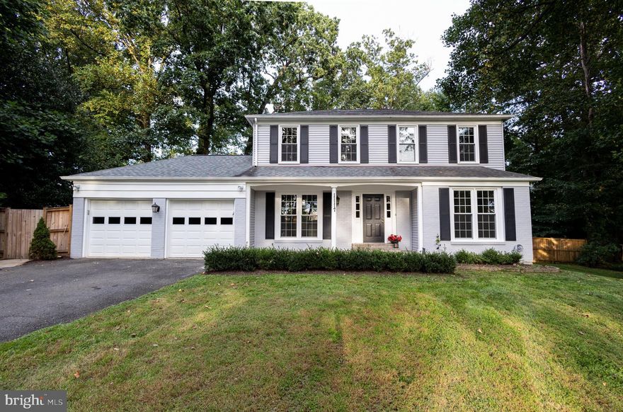 Gorgeous colonial in spectacular location, just minutes to Route 7 yet on a private lot at the end of a cul-de-sac.  Dark hardwood flooring throughout  all levels are accented by beautiful crown molding and chair rails. There is a formal living room and dining room in the front of the house,  both with large windows that let in plenty of light. The fireplaced living room is open to the stunning kitchen, complete with beautiful cream-colored cabinets, granite countertops,  tile backsplash and stainless steel appliances. The center island provides extra seating, as does the the built-in window seat.  A charming half bath completes the main level. Upstairs are 2  guest bedrooms, both with built-in closet systems, and a hall bath with fully tiled walk-in shower. The spacious master has a walk-in closet with built-ins and a spa-like master bathroom with beautiful tiling throughout, dual sinks, walk-in shower and a freestanding tub.  The fully finished basement has an updated full bath with tiled walk-in shower, a laundry room  with an abundance of storage, an office and a den. The backyard is a true oasis! Fully fenced and surrounded by trees,  it offers both grassy areas and  several seating areas with beautiful stonework , a firepit, a covered area (Pergola conveys) and a finished shed for all of your storage needs.  Come see this true gem!
