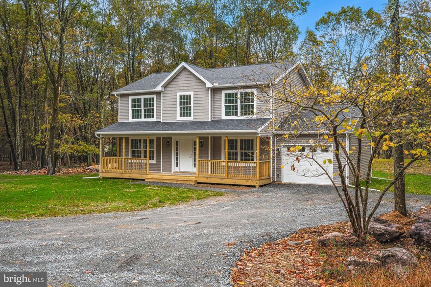 BRAND NEW BUILD - this custom designed 2 story colonial home proudly built by Swat Homes Inc offers over 2,000 square feet of finished living space within the Towamensing Trails community. This beautifully designed home features solid hardwood floors, family room with propane gas fireplace, recessed lighting and convenient first floor laundry. The gourmet kitchen is custom designed with granite countertops, stainless steel GE appliances, breakfast bar with seating for 3, convenient pantry and adjoining formal dining room. The owner's suite features a large walk-in closet and en suite bath with double vanity and shower with tile surround. Three additional bedrooms share a full bath with single vanity, linen closet, and shower with tile surround. Outdoor highlights include a covered front porch, large rear deck, upgraded vinyl siding, vinyl double hung Simonson windows, and a 30-year warrantied roof. Forced air propane heating and cooling ensures year-round comfort. Towamensing Trails offers their homeowners countless private amenities and is a unique way to experience the best the Poconos have to offer like skiing, festivals, waterparks, shopping and so much more. Additional lots & models available. Schedule today!