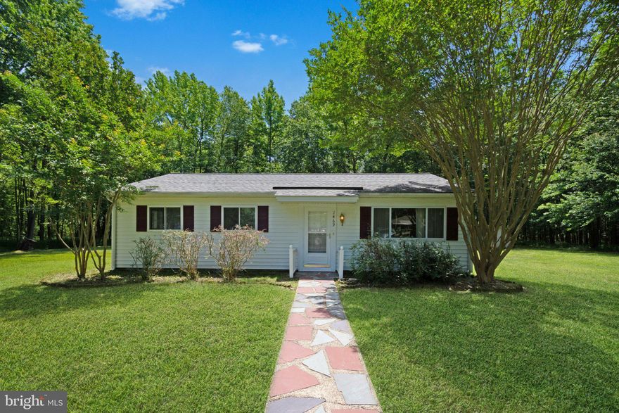 Enjoy privacy and space in this charming ranch-style home set on a beautiful 3.75-acre wooded lot. A welcoming stone walkway leads you to the front door. Inside, the home features a spacious living room that flows seamlessly into the kitchen, offering plenty of room for a dining table. The primary bedroom includes an en-suite bathroom with a shower, while two additional bedrooms share a full hallway bath with a tub. Step outside to a concrete patio overlooking a large, private yard surrounded by mature trees. A storage shed provides extra space, and the paved driveway offers ample parking. Roof replaced 2020. Listed for sale and for rent.