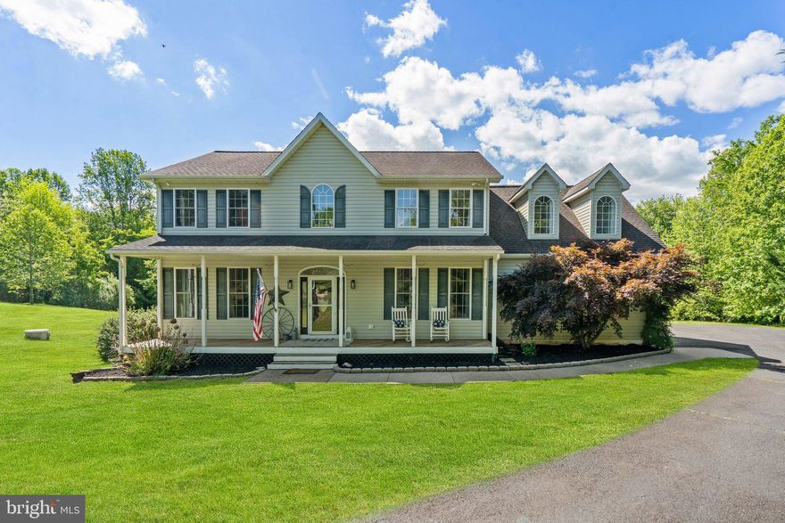 This one is a WOW!  Welcome to this lovely 4 bedroom Colonial in the most magnificent setting.  Privately situated on 2.5 acres, yet conveniently located close to amenities, this home is what you have been looking for.  Upon arriving, you'll immediately fall in love with the (rocking chair required) front porch.  Opening the front door, the first thing to catch your eye will be the custom wall feature, creating a view to the spacious family room with doors to the screened in porch, deck and views! The main level has a great flow for family and friends.  Large kitchen with eat-in area, granite countertops, stainless steel appliances, white cabinetry and open shelving.  The dining room currently being used as a library/music room, makes a great flex room since the kitchen includes a large area for dining.  Upstairs you will find 4 very spacious bedrooms and convenient laundry room.  The private spacious primary bedroom with ensuite bathroom is one more reason to love this home!  Large, walk-out unfinished basement with rough in, is perfect for storage and/or future expansion.  If this wasn't enough, the exterior will amaze you!  From the screened in porch, to the deck with outside sink, to the fenced in backyard and your private pond stocked with blue gill and largemouth bass, you'll think you're dreaming.  Enjoy!