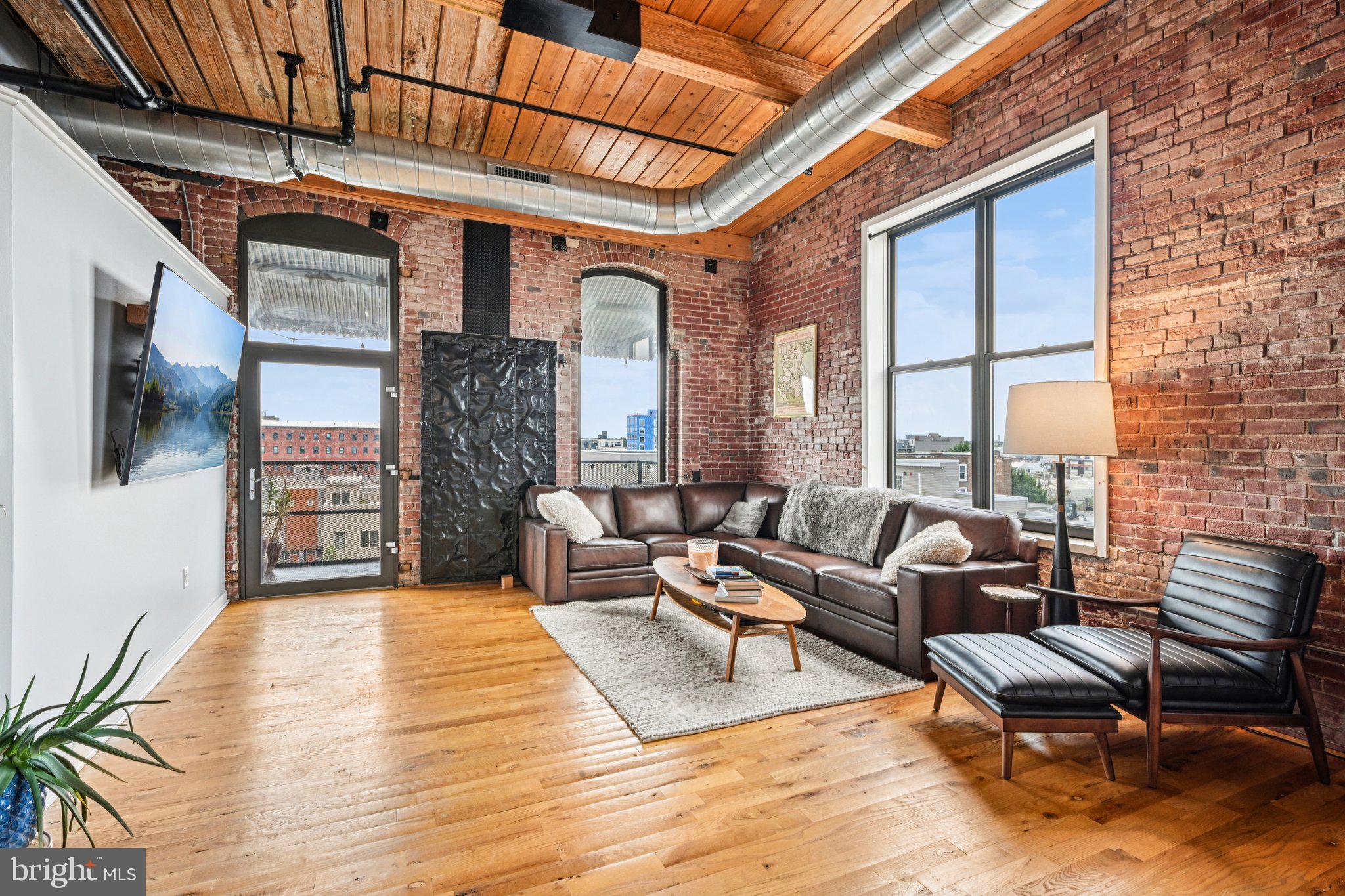 Stylish and modern, this loft-style condo in the heart of Fishtown offers 1 bedroom and 1.5 baths with soaring ceilings, large windows, and abundant natural light. The open living space features a high-end kitchen with an island and plenty of cabinetry, while a private balcony provides sweeping views. The spacious bedroom includes an ensuite bathroom, complemented by an additional half bath off the foyer. A rare find in the neighborhood, this home also comes with one assigned space in the gated parking lot. Perfectly situated near Hancock Street Playground and just a short distance to shops, cafes, and eateries, this condo combines convenience, comfort, and an unbeatable location. *Mortgage savings may be available for buyers of this listing.*