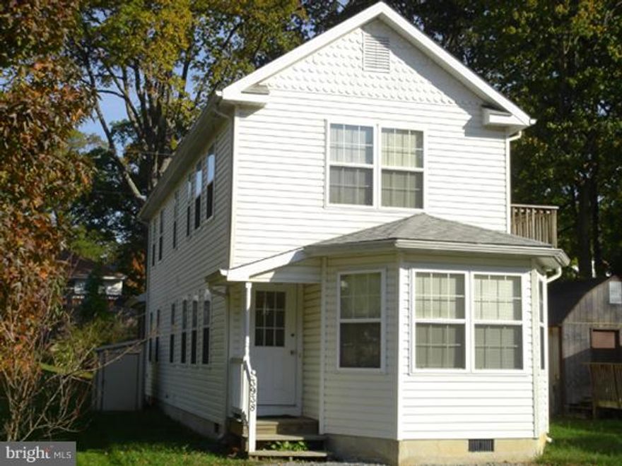 Spacious Kitchen with Center island is adjacent to open dinning Ares surrounded by Bay Windows. Hardwood floors throughout  the main level.The living room is complimented  by a Screened Porch.  Each bedroom has it's on bath.  Deck , with a peek of the Ches. Bay is off the Master Bdrm. Some maintenance / repairs being done, along with a thorough cleaning. $50 Mo W/S