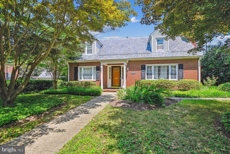 Discover the perfect blend of classic charm and contemporary elegance in this stunning brick home with a slate roof and lush professional landscaping. Nestled in the coveted Stoneleigh community, this home boasts storybook curb appeal and a wealth of luxurious features. A major renovation completed in 2021 has transformed this home, creating a gourmet kitchen with an open concept floor plan, perfect for modern living. The kitchen features high-end appliances, custom cabinetry, and ample counter space, making it a chef's dream. The magnificent first floor primary bedroom suite offers a spa-like retreat with a renovated bathroom that includes a floating vanity, a large shower with a rain head spout, and exquisite tile work. This sanctuary provides a peaceful escape at the end of a long day. Throughout the home, you'll find classic features such as hardwood floors, a wood-burning fireplace in the living room, crown moldings, and beautiful built-ins. The upper-level features three bedrooms and a renovated bathroom, providing ample space for family and guests. Nearly every major system has been addressed, ensuring years of carefree living without expensive surprises, including updated A/C, roof, replacement windows, and gutters.  Step outside to the large private backyard, complete with a spacious deck that backs to serene trees, offering a tranquil outdoor oasis. The Stoneleigh community enhances your lifestyle with amenities such as a neighborhood pool, basketball courts, a picnic area, and a tot lot/playground. This exquisite home combines quality construction, luxury finishes, and unparalleled amenities, making it a rare gem in the Stoneleigh community. Don't miss your chance to own this remarkable property.
