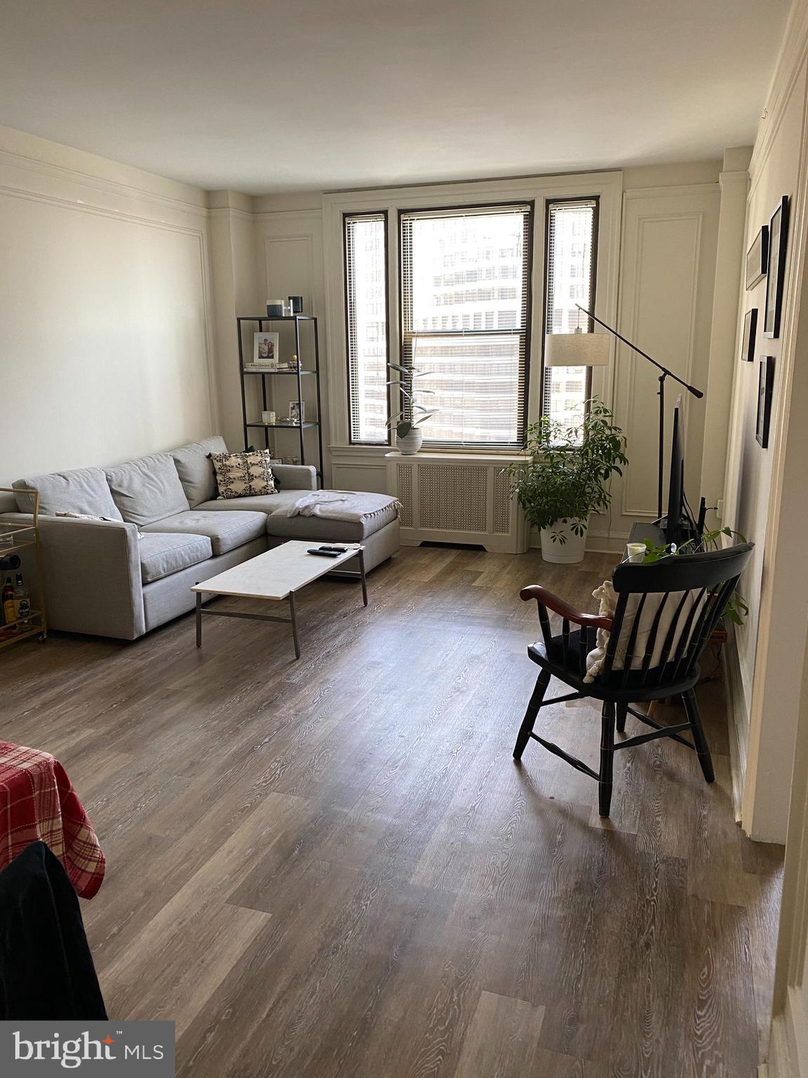 Beautifully appointed two bedroom, one bathroom on a high floor of The Carlyle, located steps from Rittenhouse Square! This updated residence features gray vinyl flooring throughout and a grand living and dining room providing lots of natural light. Adjacent, there is a renovated kitchen with white shaker cabinetry, quartz countertops, stainless steel appliances and a pantry. Both bedrooms offer oversized windows and great closet space. There is a full hall bathroom with a white single vanity and shower/tub combination. Additionally, there is a stackable washer/dryer in the unit. The Carlyle is a pet-friendly, doorman building only one block from Rittenhouse Square. Rent includes the security of a 24-hour doorman and use of the building's state-of-the-art gym. Electric, gas, and water are all based on square footage. Tenants pay cable and internet.