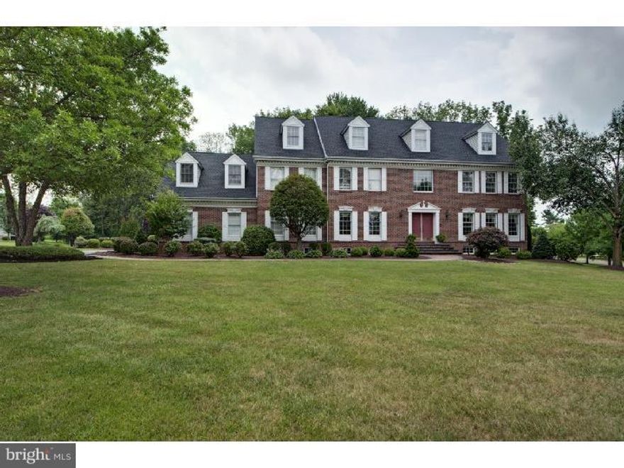 Expansive & Stately 3 Story Brick Front Georgian Colonial in Hidden Lake Estates on a premium corner lot. This 5 Bedroom, 5.3 Bath home has been beautifully maintained and offers a first floor Office, hardwood floors, Third floor Guest Suite, marble inset on Second floor, custom molding and spacious room sizes.  The Kitchen contains granite counters, a large eat-in island with gas cooktop, tile floor, built-in desk, Breakfast Area and is open to the Gathering Room with gas Fireplace and wet bar. The lovely Main Suite is private and has a vaulted ceiling, Sitting Room with balcony and luxurious Bath.  All Bedrooms are ensuite.  The Lower Level is finished with an exercise space, recreation room, bar, TV area, half bath and storage room.  Surrounding the home is gorgeous professional landscaping, a back paver patio, deck and custom heated pool with spa.